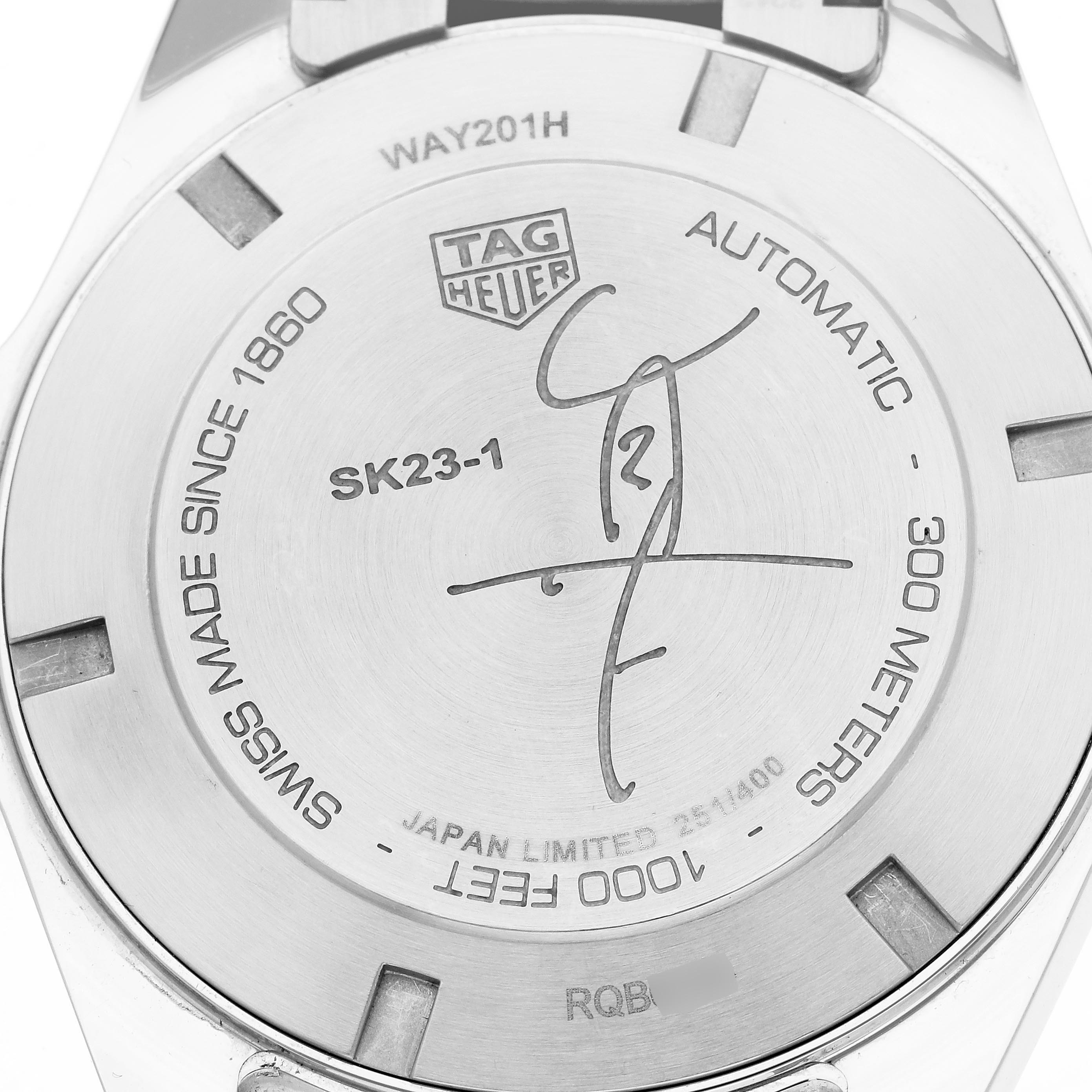 The image shows the back of a Tag Heuer Aquaracer WAY201H.BA0927 Men
s Stainless Steel Blue Dial WAY201H.BA0927 Men
s Stainless Steel Blue Dial watch, featuring engraved model details and specifications.