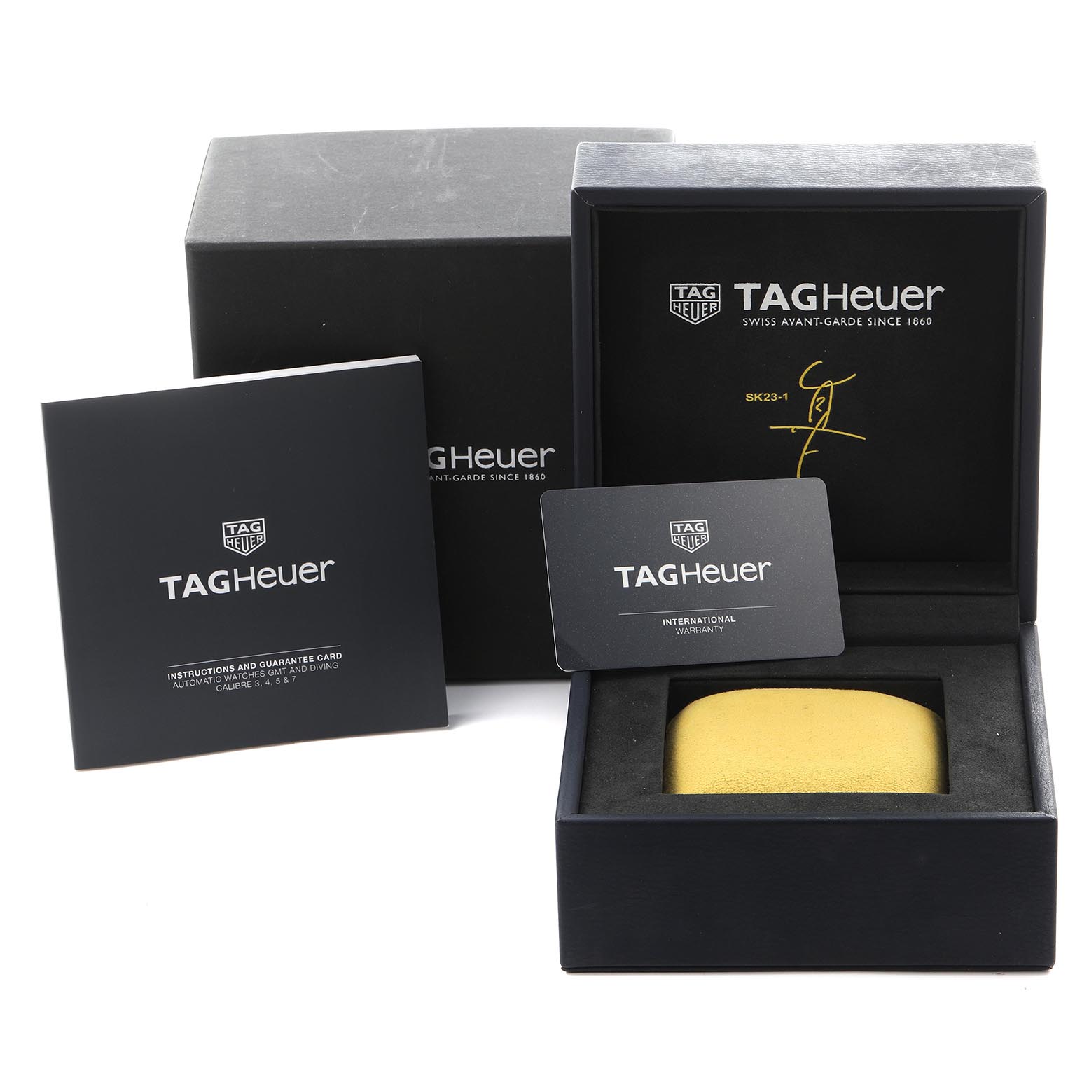 The image shows the packaging and warranty card for the Tag Heuer Aquaracer WAY201H.BA0927 Men
s Stainless Steel Blue Dial WAY201H.BA0927 Men
s Stainless Steel Blue Dial, including the outer box, instruction booklet, and display case.