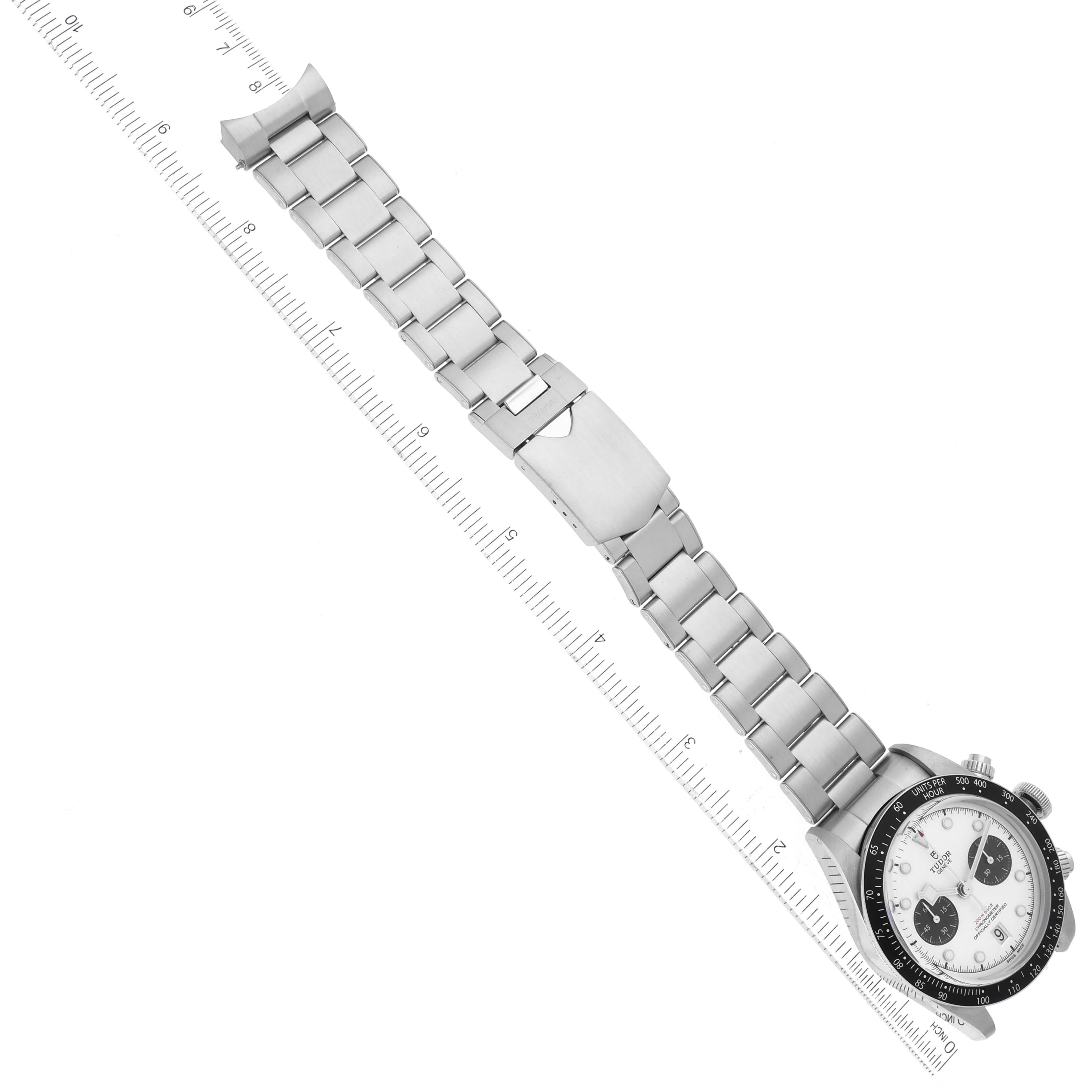 This top-view image shows a Tudor Heritage Black Bay 79360N Men's Stainless Steel Silver Dial 79360N Men's Stainless Steel Silver Dial watch and band, aligned with a ruler for scale.