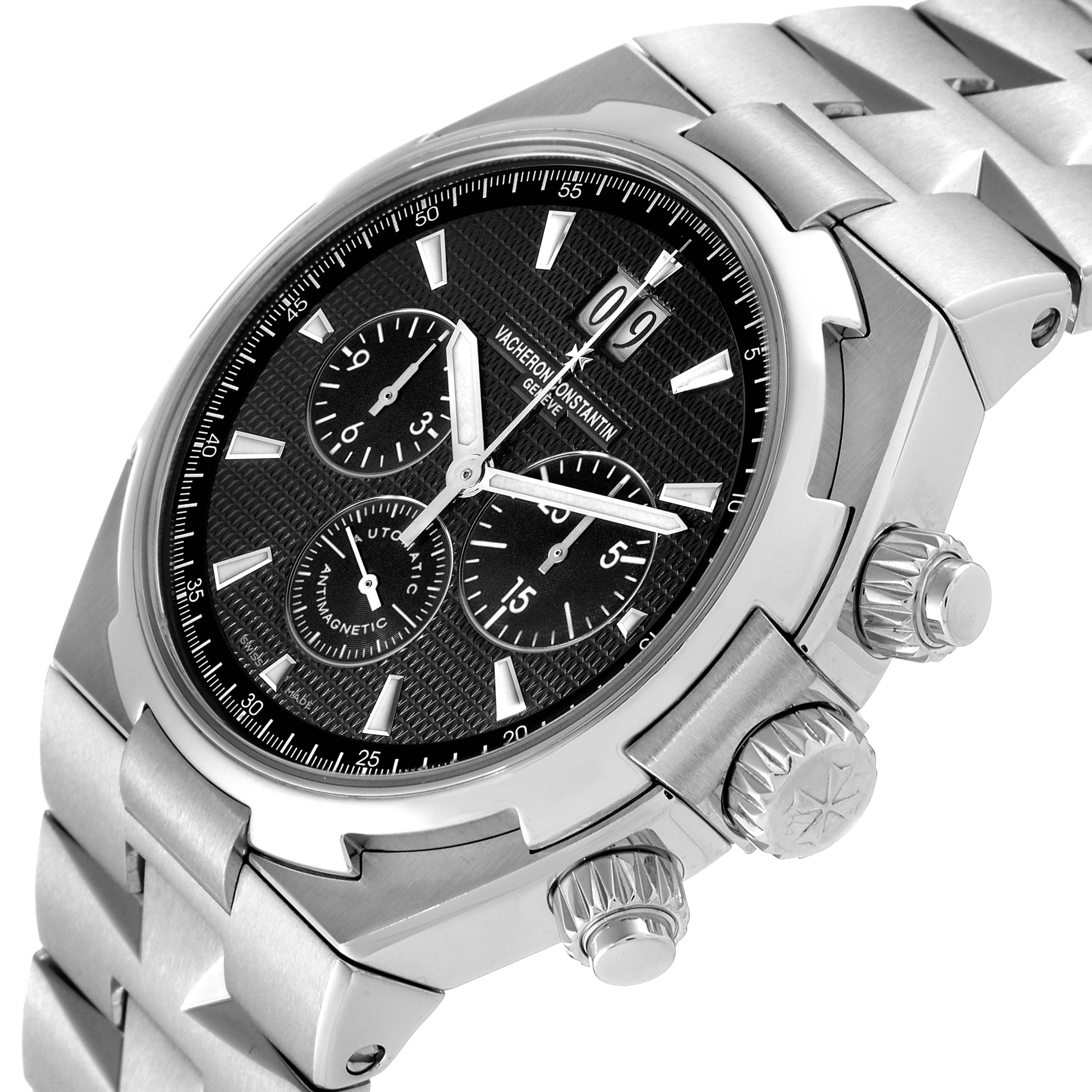 The Vacheron Constantin Overseas 49150/B01A Men's Stainless Steel Black Dial 49150/B01A Men's Stainless Steel Black Dial watch is shown at an angled close-up, highlighting the dial, chronograph subdials, and crown.