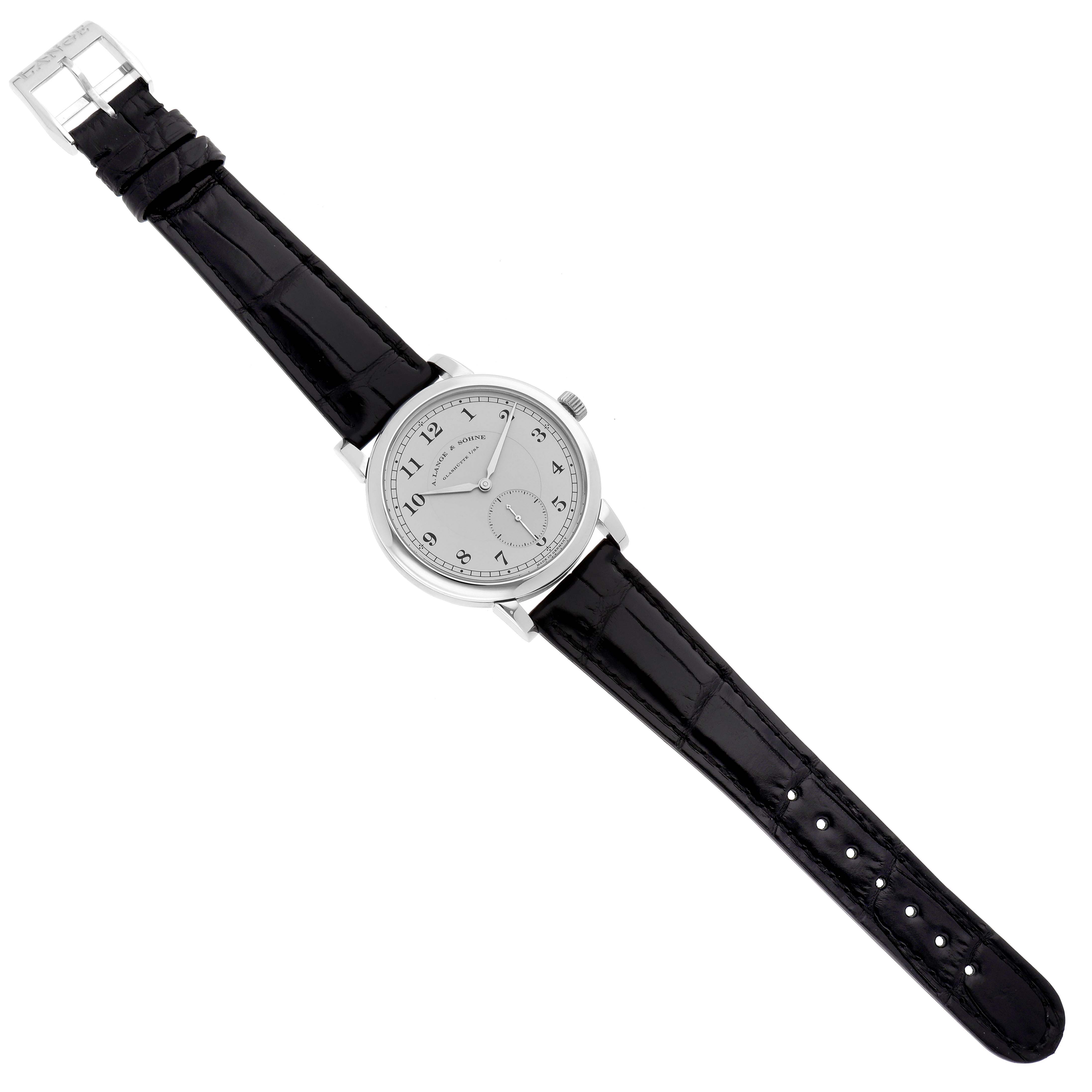 The image shows an A. Lange & Sohne 1815 233.025 Men's Platinum Silver Dial model watch viewed from the top, displaying the face, case, and full leather strap.