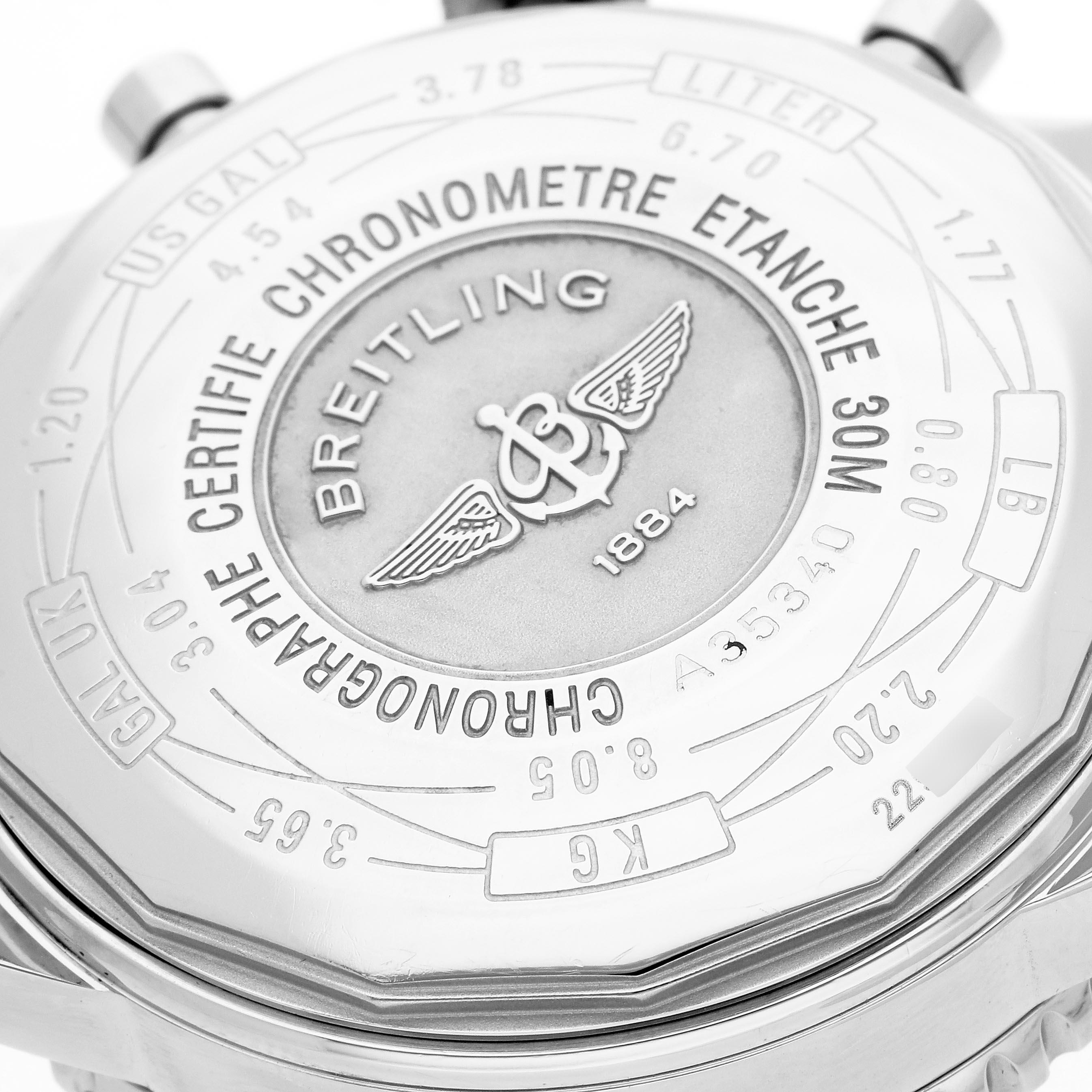 The image shows the back case of a Breitling Navitimer A35340 Men
s Stainless Steel Blue Dial A35340 Men
s Stainless Steel Blue Dial watch with detailed engravings and branding.