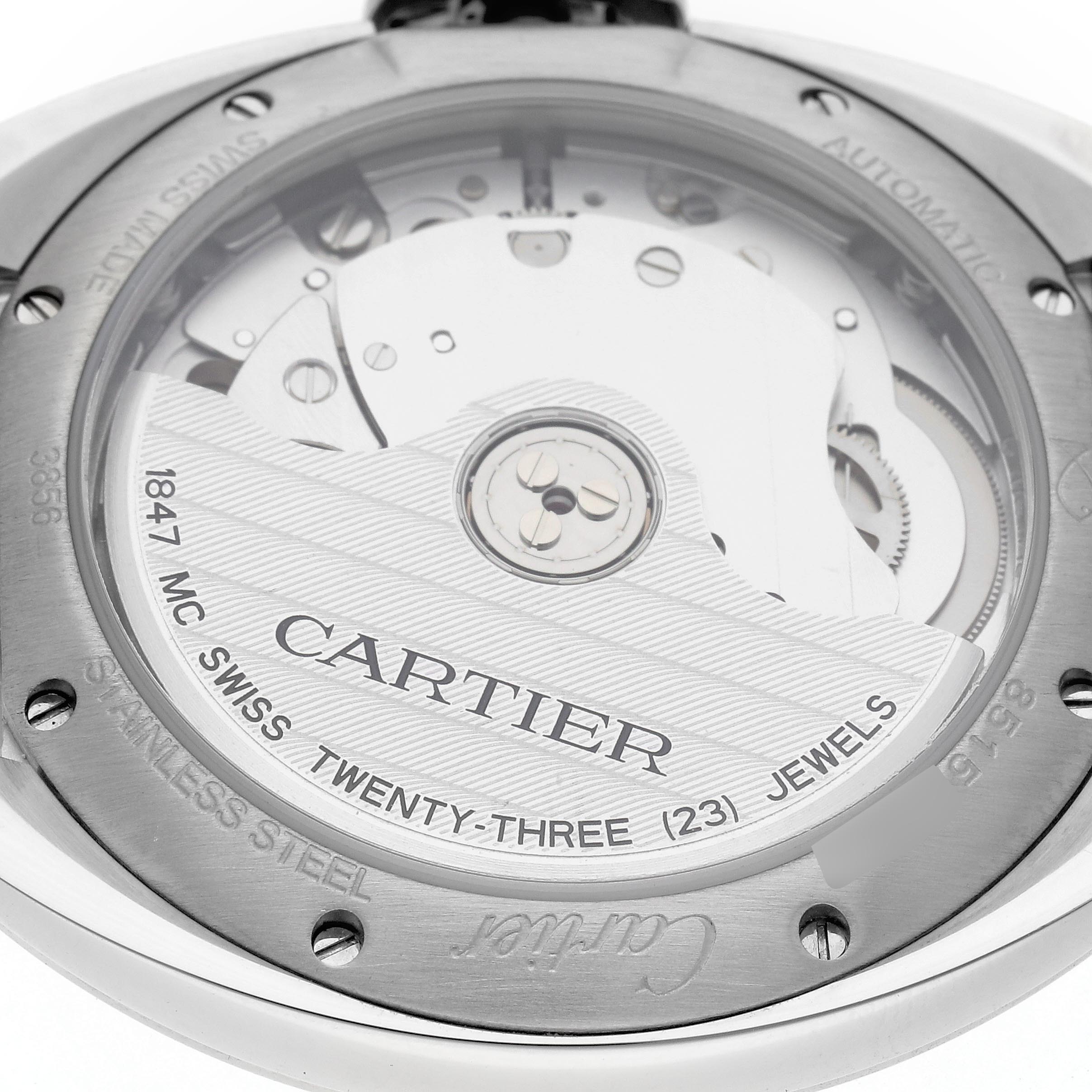 The image shows the back of the Cartier Clé watch, highlighting its movement and engravings.