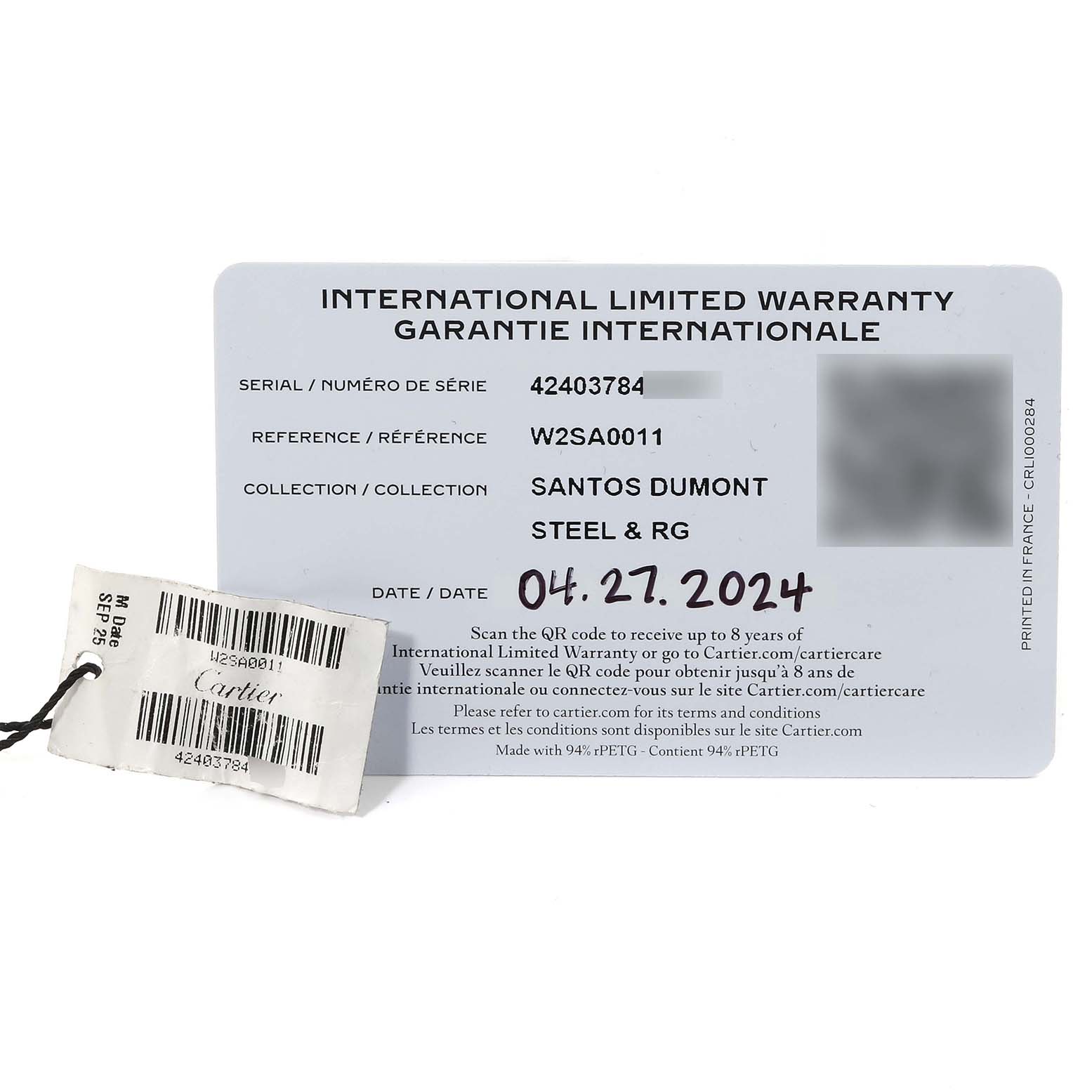 This image shows the international warranty card and barcode tag for the Santos Dumont watch by Cartier.