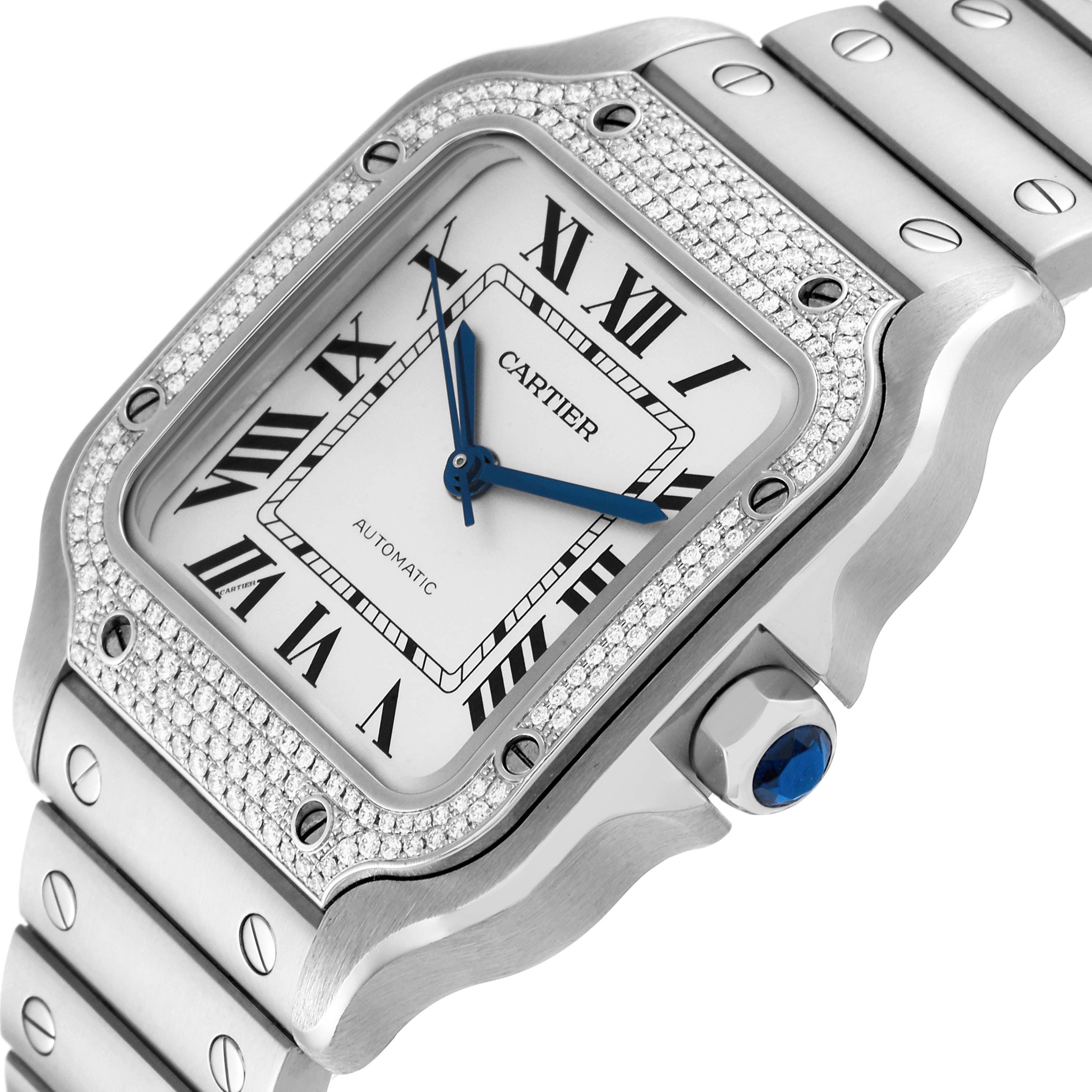 The image shows a close-up of the face and bracelet of a Cartier Santos W4SA0005 Men
s Stainless Steel Silver Dial W4SA0005 Men
s Stainless Steel Silver Dial watch, highlighting its bezel and crown.