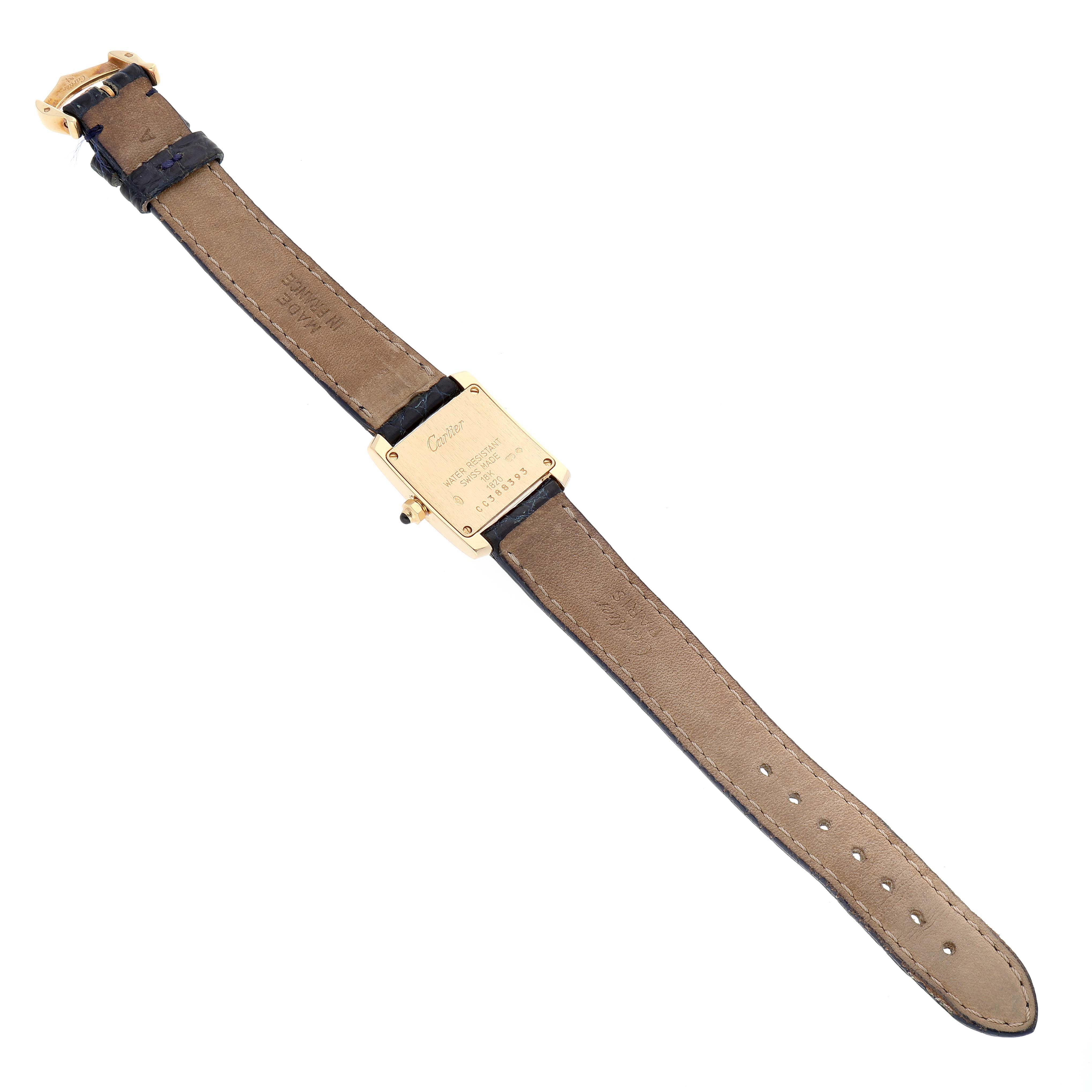 The image shows the back view of a Tank Française watch by Cartier, displaying the strap and case back.