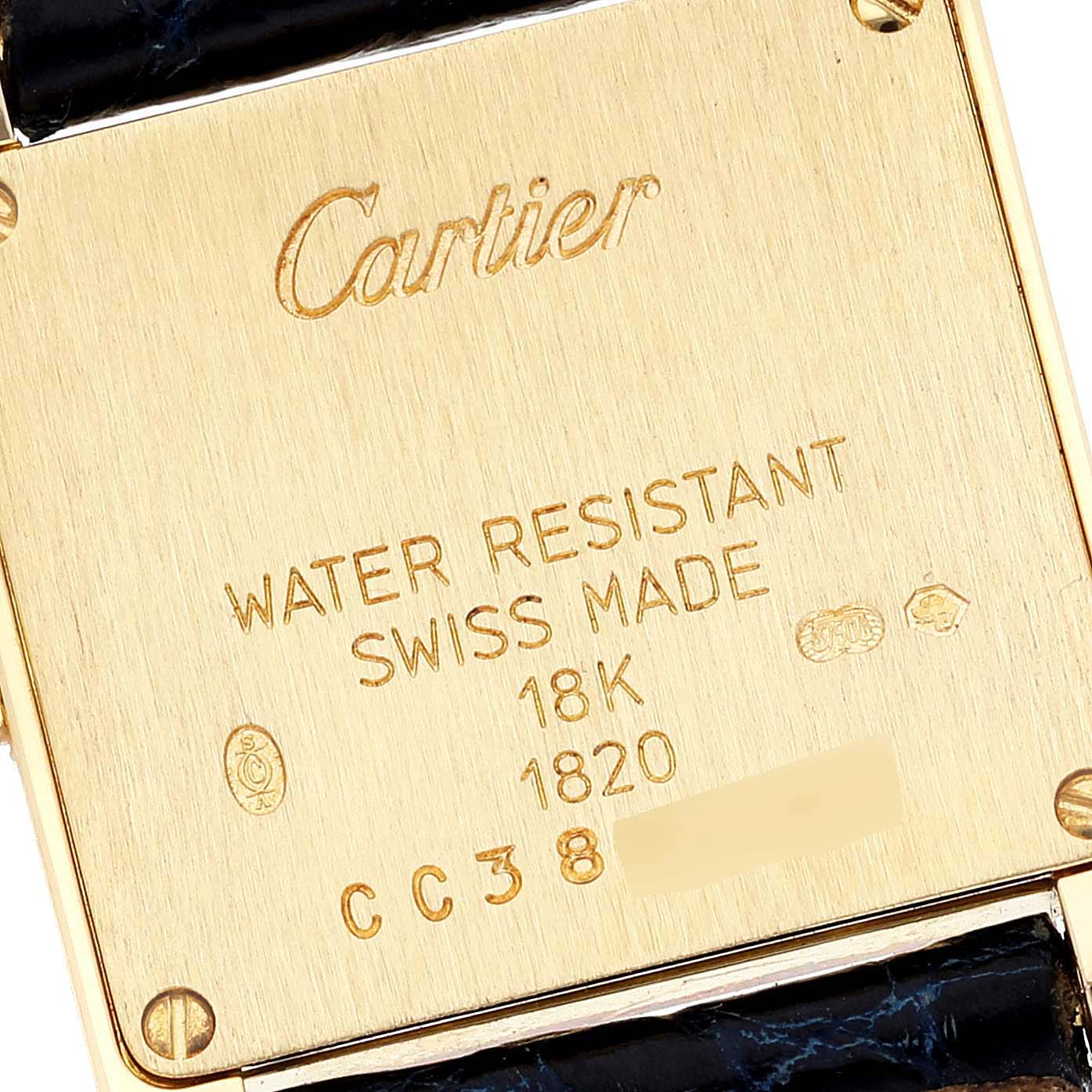 The image shows the back cover of a Cartier Tank Francaise W5000256 Women's Yellow Gold Silver Dial W5000256 Women's Yellow Gold Silver Dial watch, indicating it is 18K gold and water-resistant.