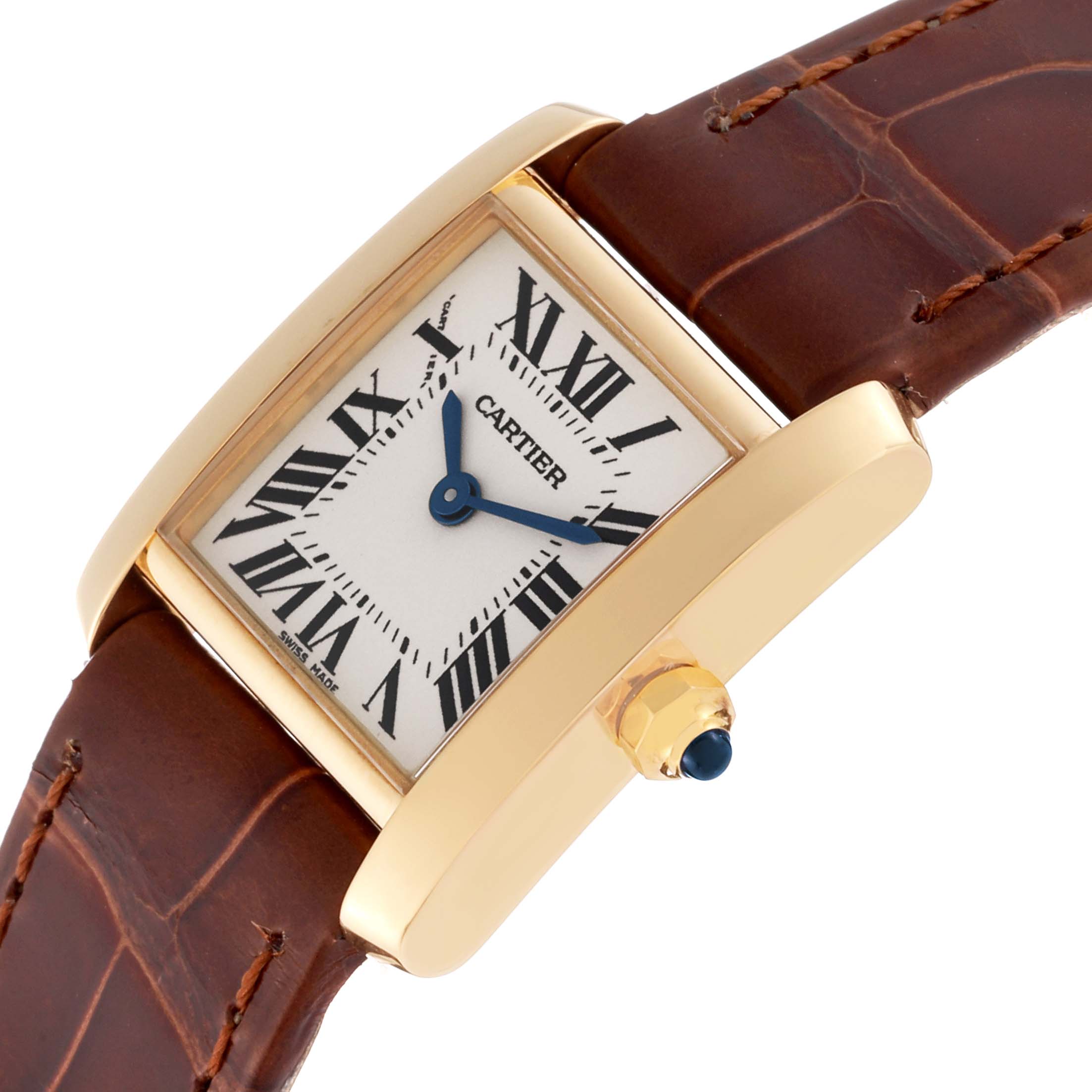 This image shows a Cartier Tank Française watch at an angle, highlighting its gold case, white dial, Roman numerals, and brown leather strap.