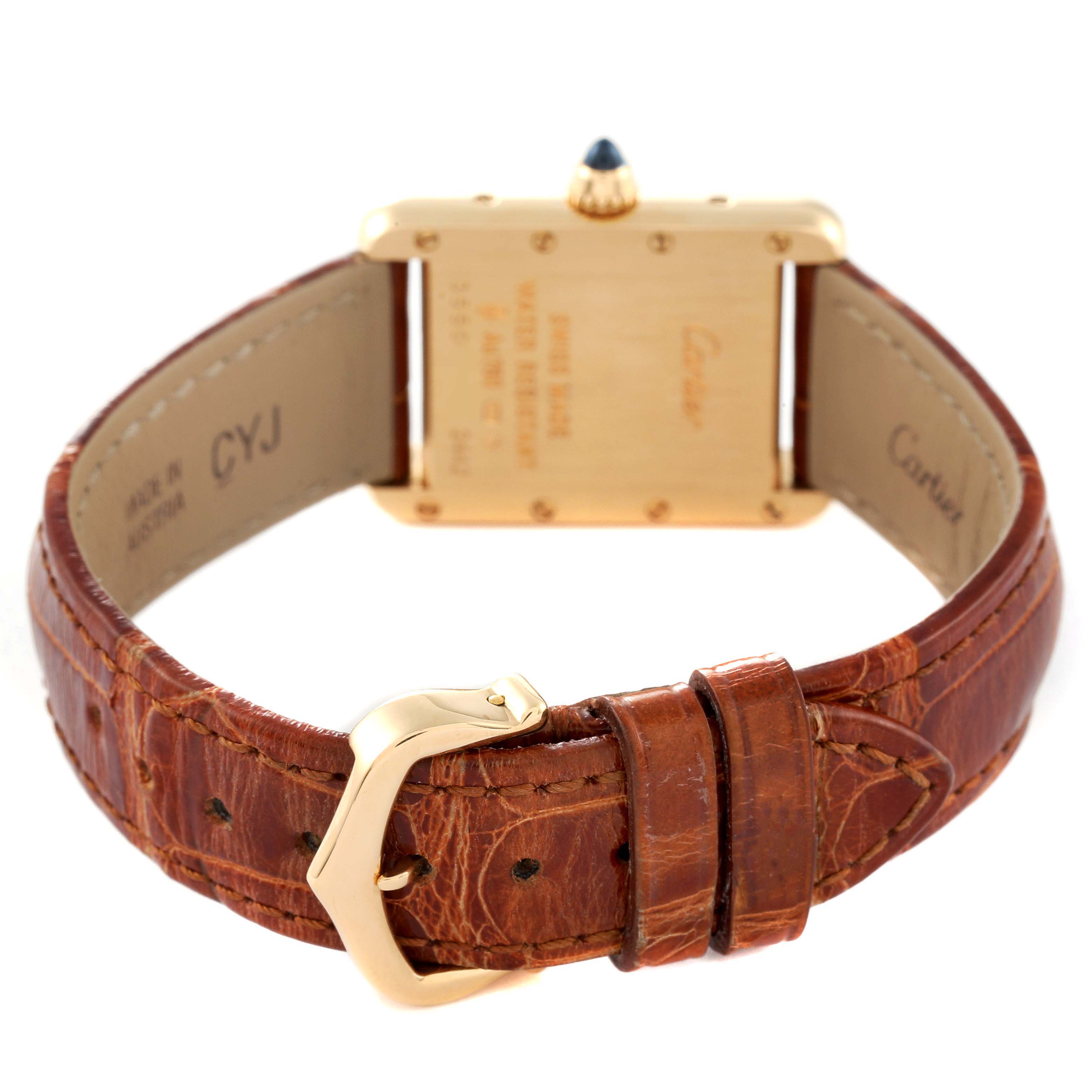 This image shows the back and strap of the Cartier Tank Louis W1529856 Women's Yellow Gold Silver Dial W1529856 Women's Yellow Gold Silver Dial watch, highlighting its brown leather band and gold buckle.