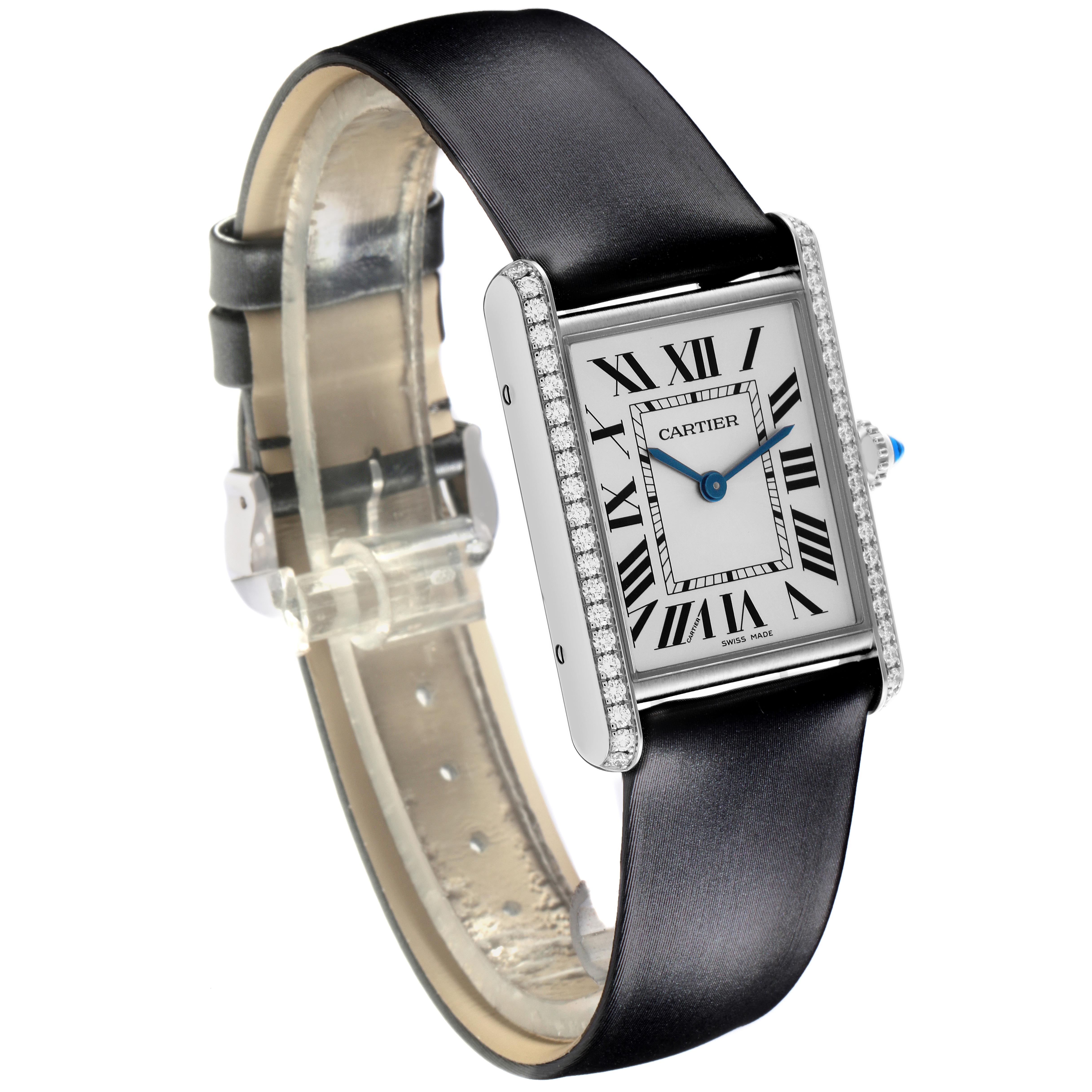 The Cartier Tank Must W4TA0017 Women
s Stainless Steel Silver Dial W4TA0017 Women
s Stainless Steel Silver Dial watch is shown at an angle highlighting the face, strap, and diamond-set case sides.