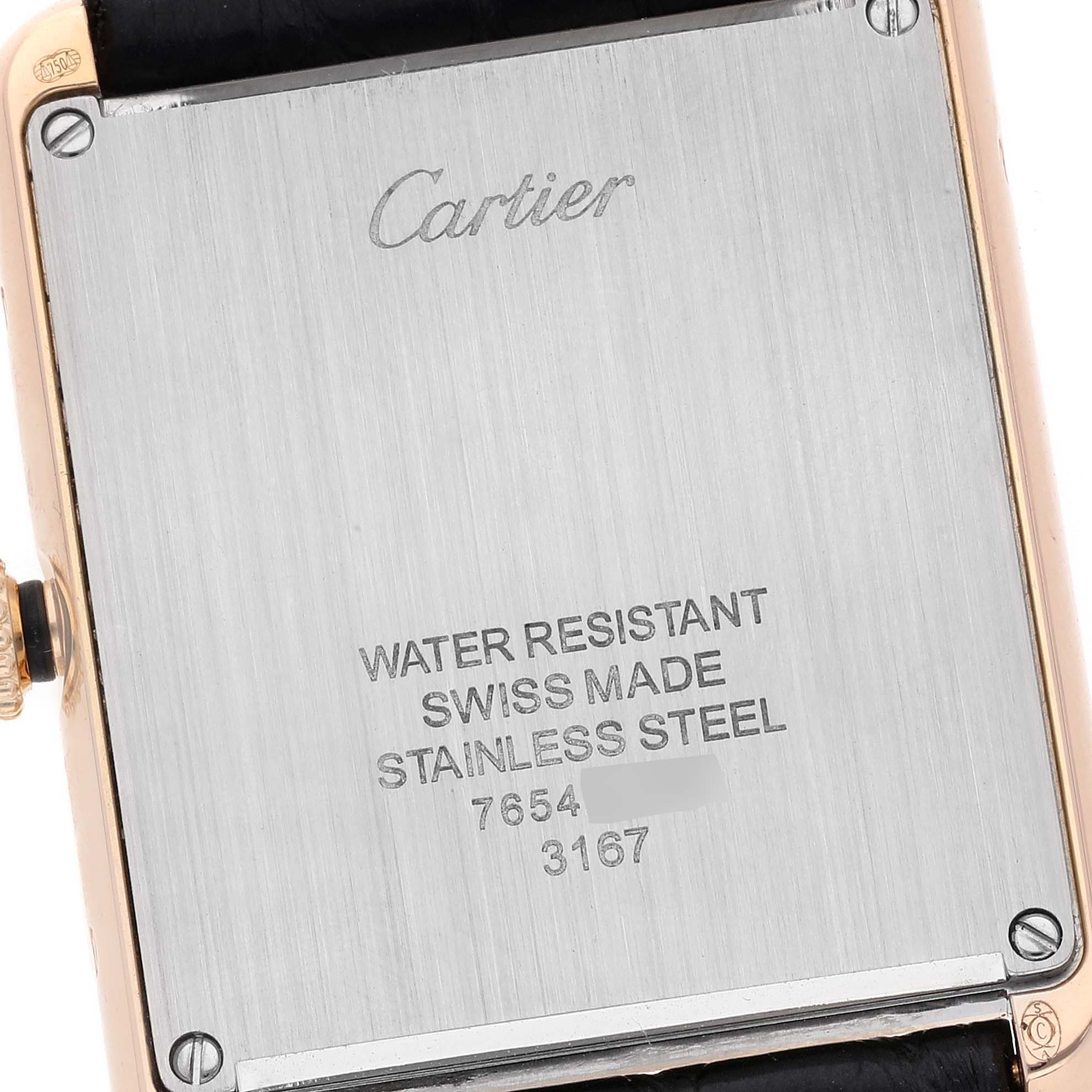 The image shows the back of a Cartier Tank Solo W5200025 Men
s Yellow Gold Silver Dial W5200025 Men
s Yellow Gold Silver Dial watch, highlighting its stainless steel case and engraved inscriptions.