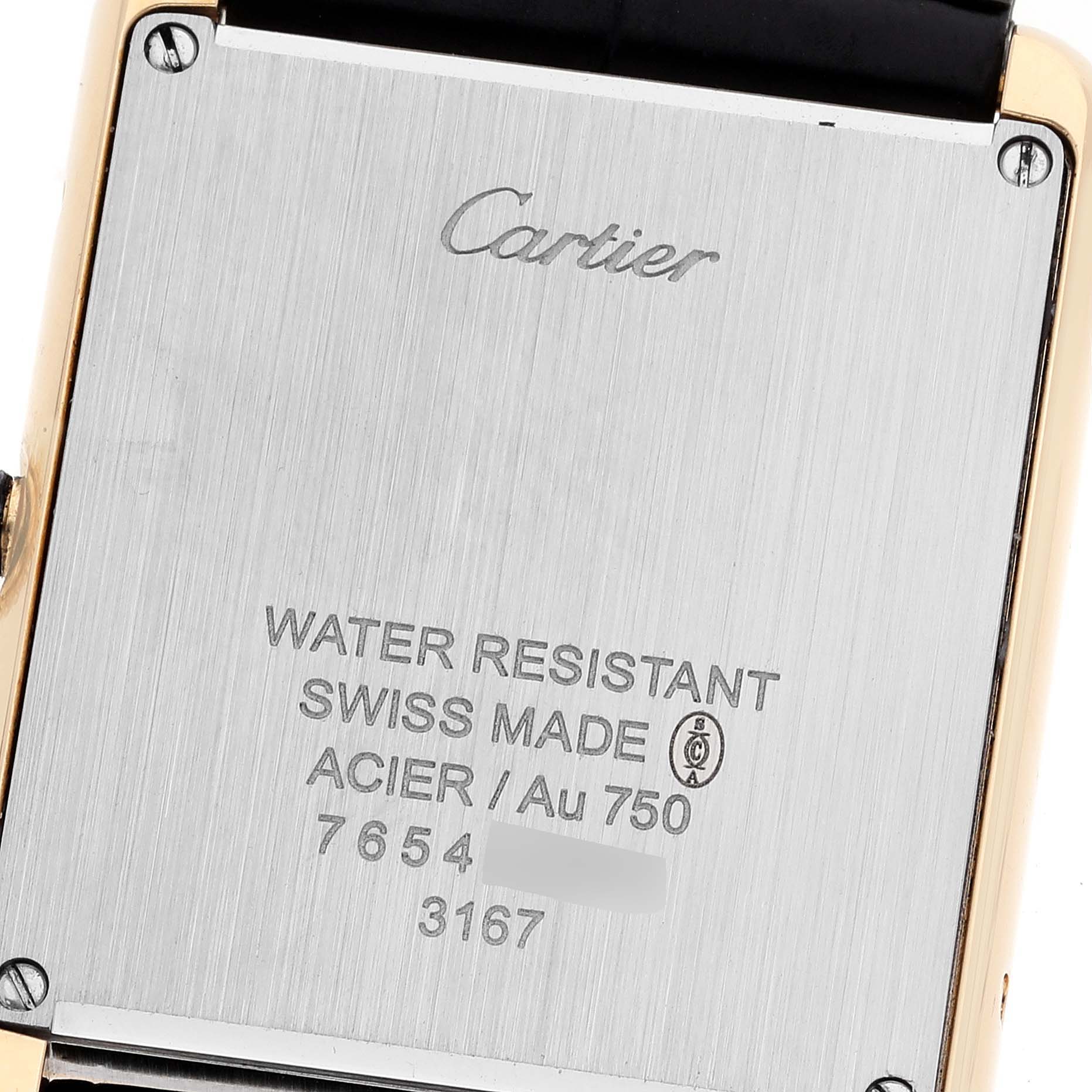 This close-up image shows the case back of a Cartier Tank Solo W5200004 Men
s Yellow Gold Silver Dial W5200004 Men
s Yellow Gold Silver Dial watch, highlighting the brand engraving and specifications.