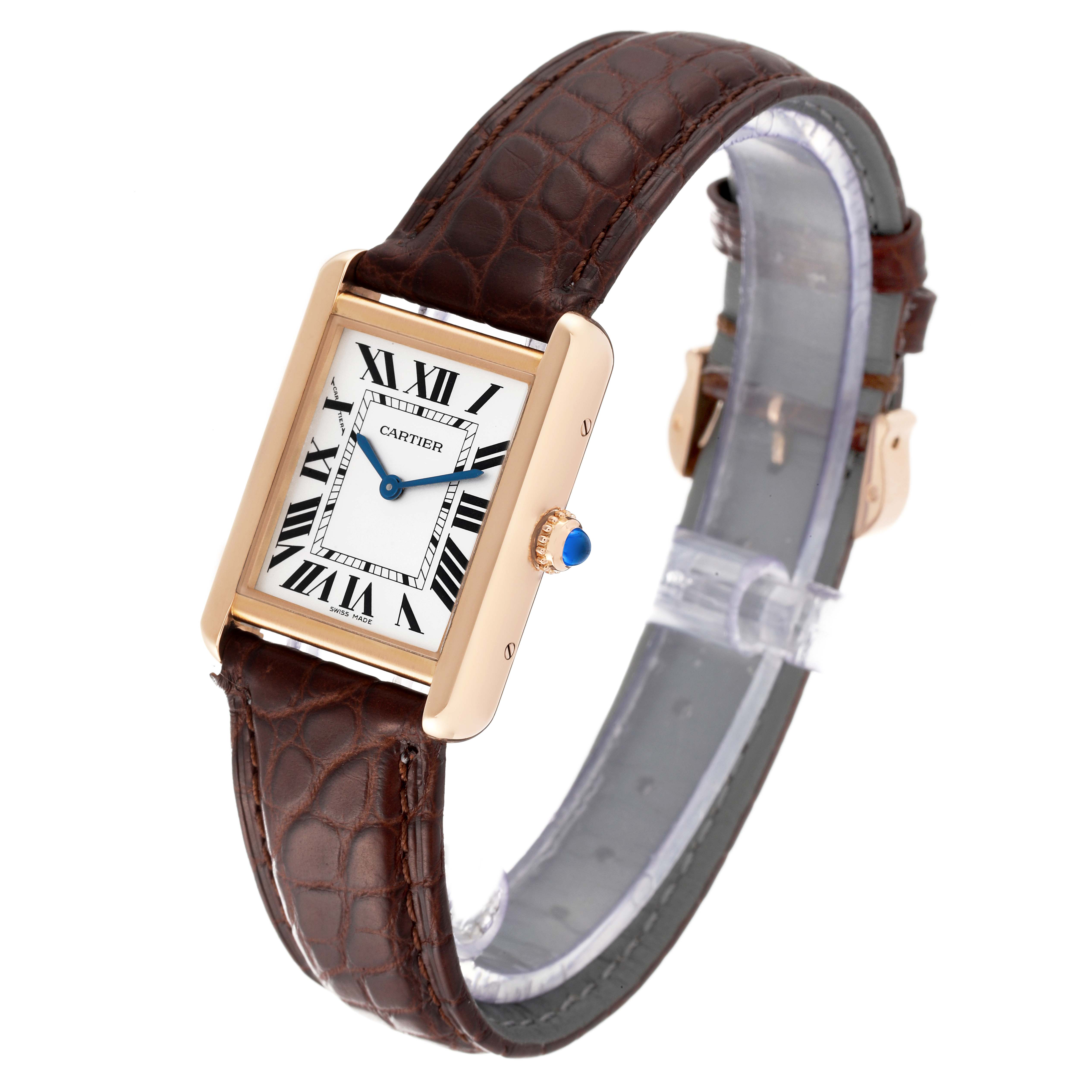 The Cartier Tank Solo W5200024 Women
s Rose Gold Silver Dial W5200024 Women
s Rose Gold Silver Dial watch is shown at a tilted angle highlighting its rectangular face, brown leather strap, and signature blue cabochon crown.