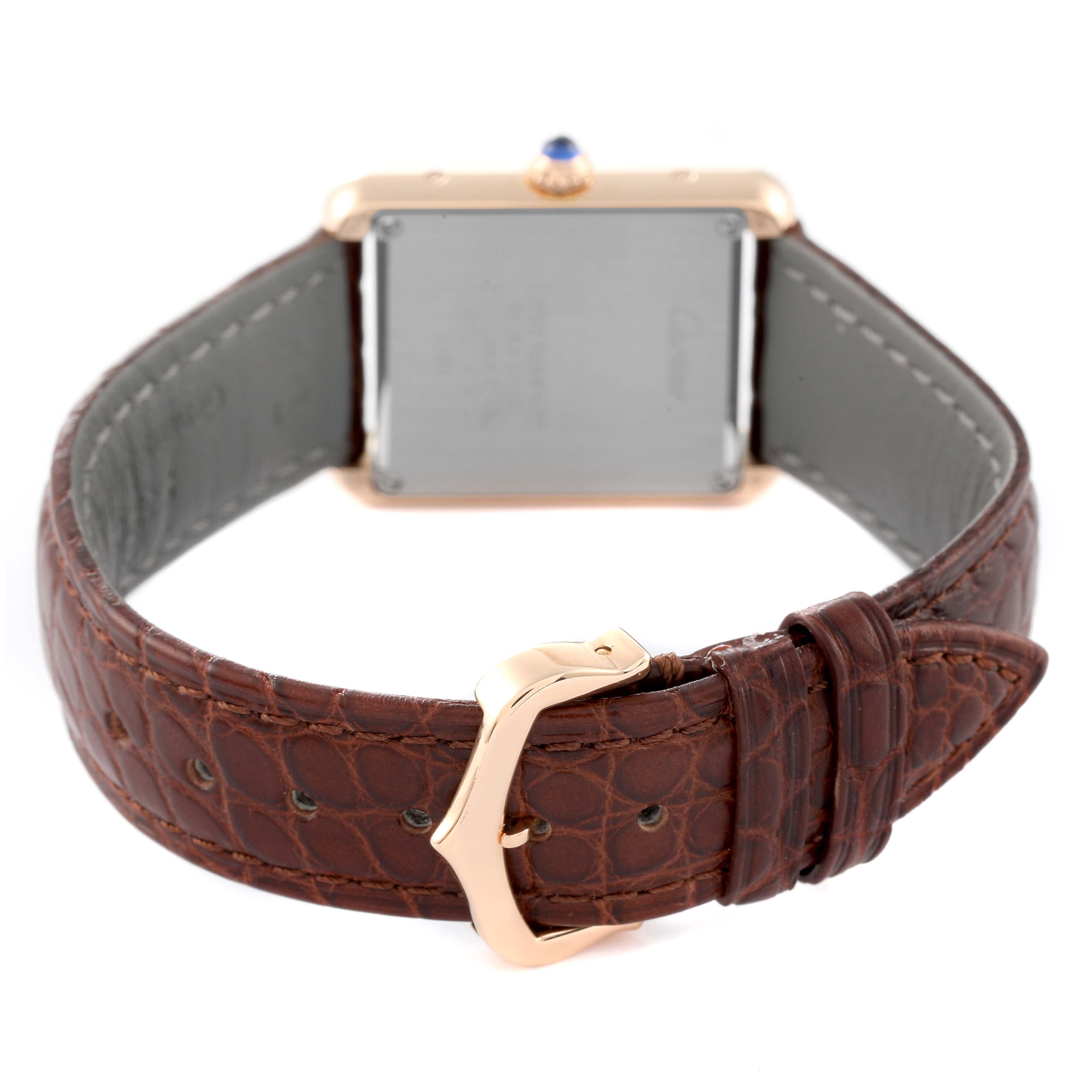 This image shows the back case, crown, and brown leather strap with a clasp of the Cartier Tank Solo W5200024 Women
s Rose Gold Silver Dial W5200024 Women
s Rose Gold Silver Dial watch.