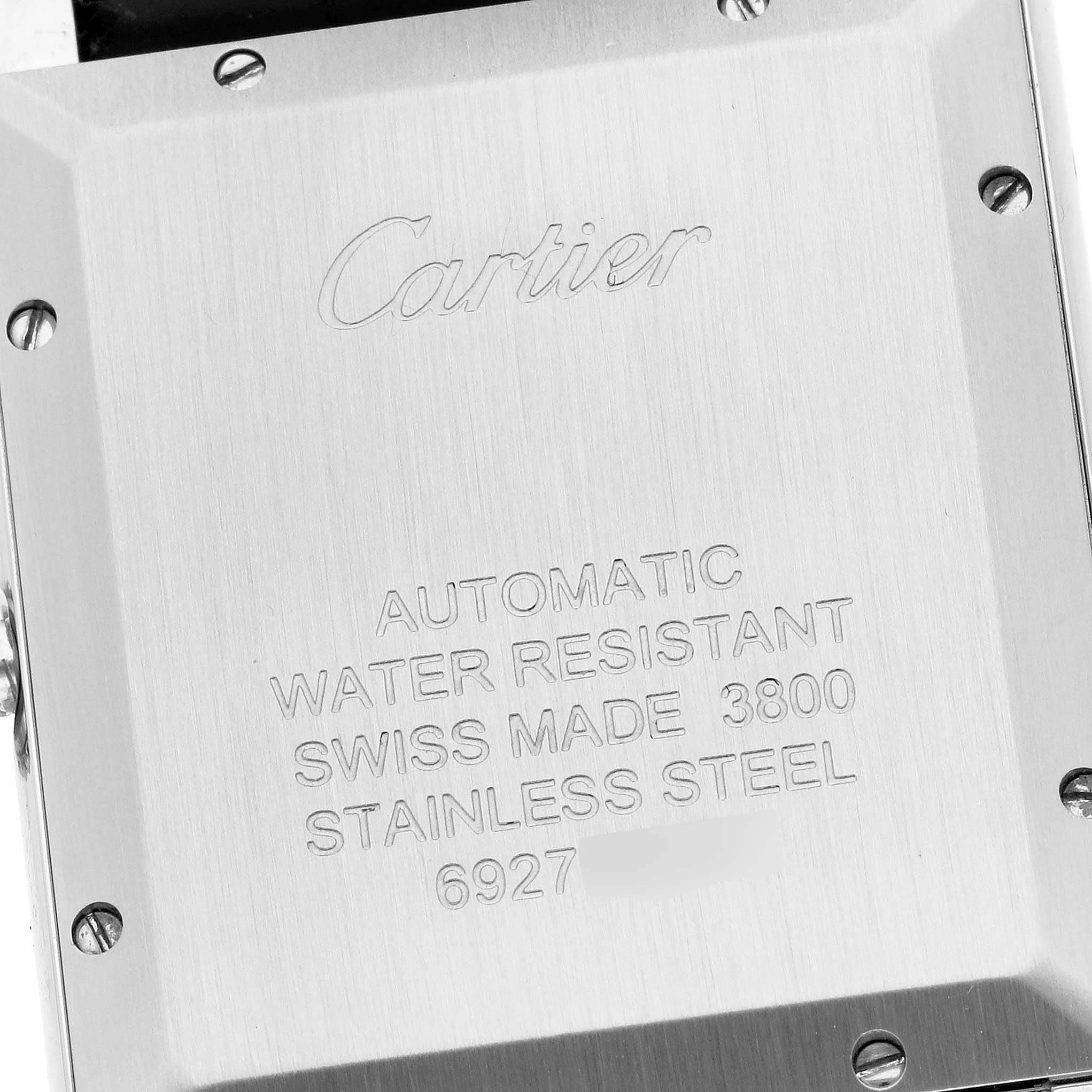 This image shows the back case of the Cartier Tank Solo WSTA0029 Men
s Stainless Steel Silver Dial WSTA0029 Men
s Stainless Steel Silver Dial watch with engraved details and screws.