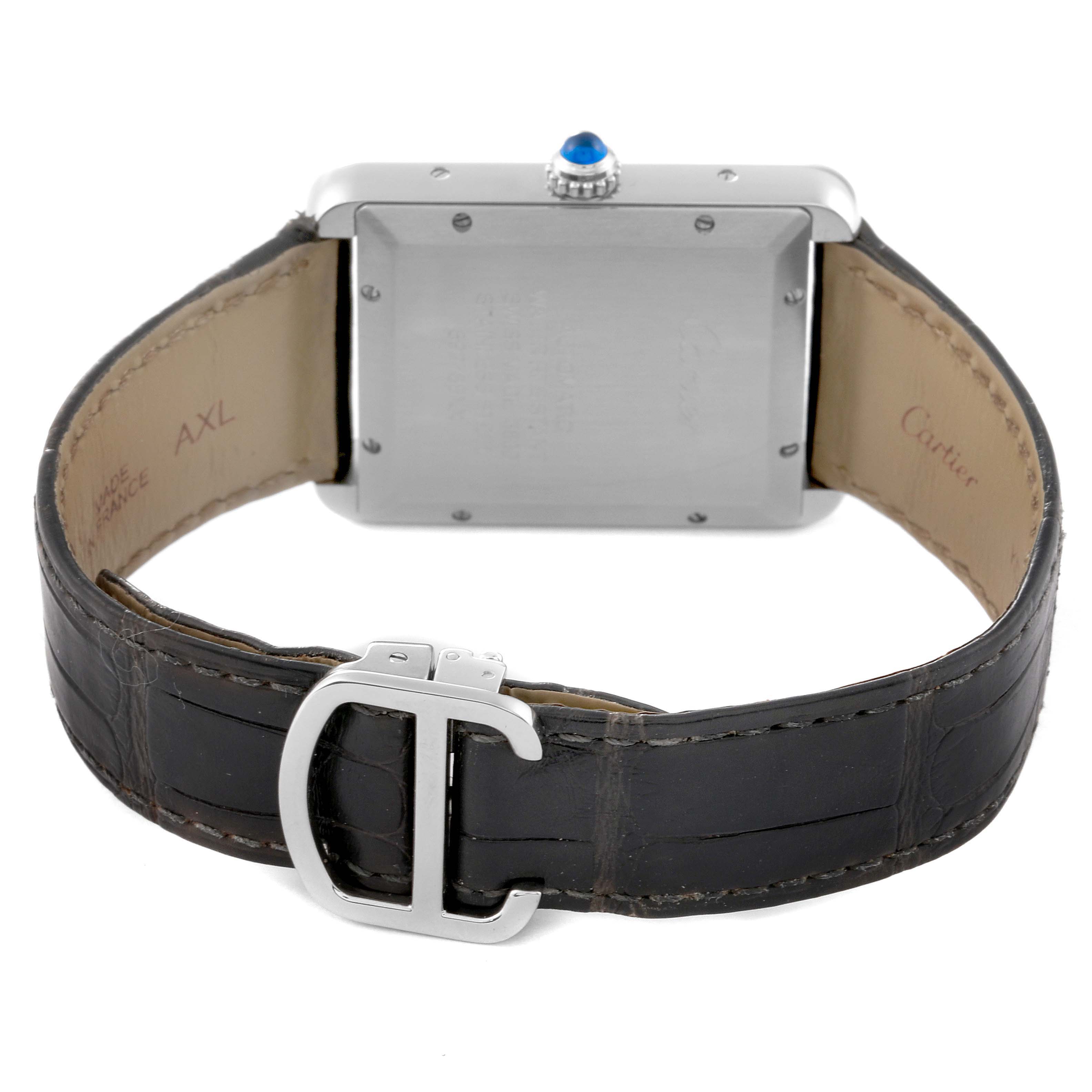 The image shows the back of a Cartier Tank Solo WSTA0029 Men
s Stainless Steel Silver Dial WSTA0029 Men
s Stainless Steel Silver Dial watch, highlighting the case, crown, and leather strap with a buckle.