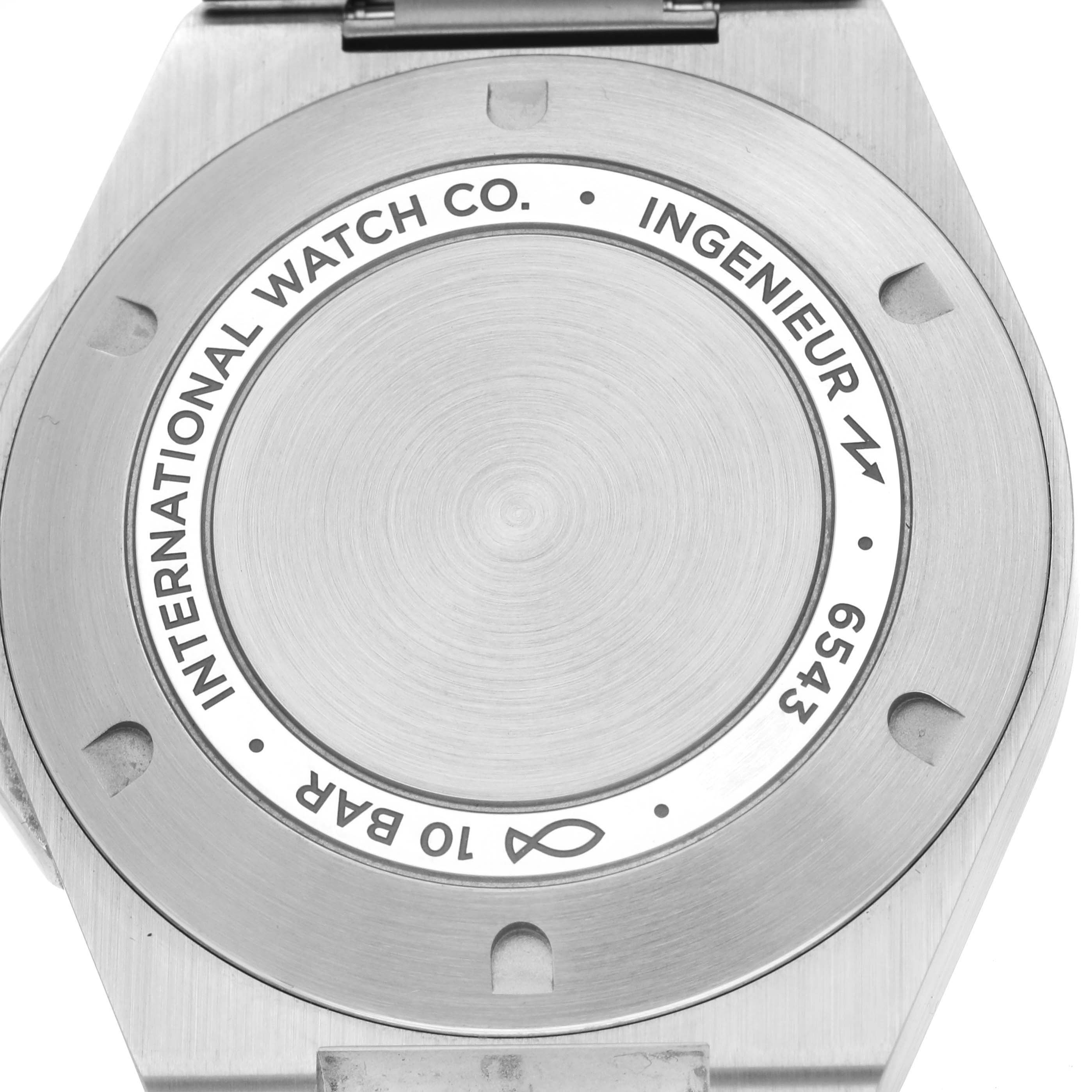The image shows the back of an IWC Ingenieur IW328907 Men
s Stainless Steel Blue Dial IW328907 Men
s Stainless Steel Blue Dial watch, highlighting its case back and etched details.