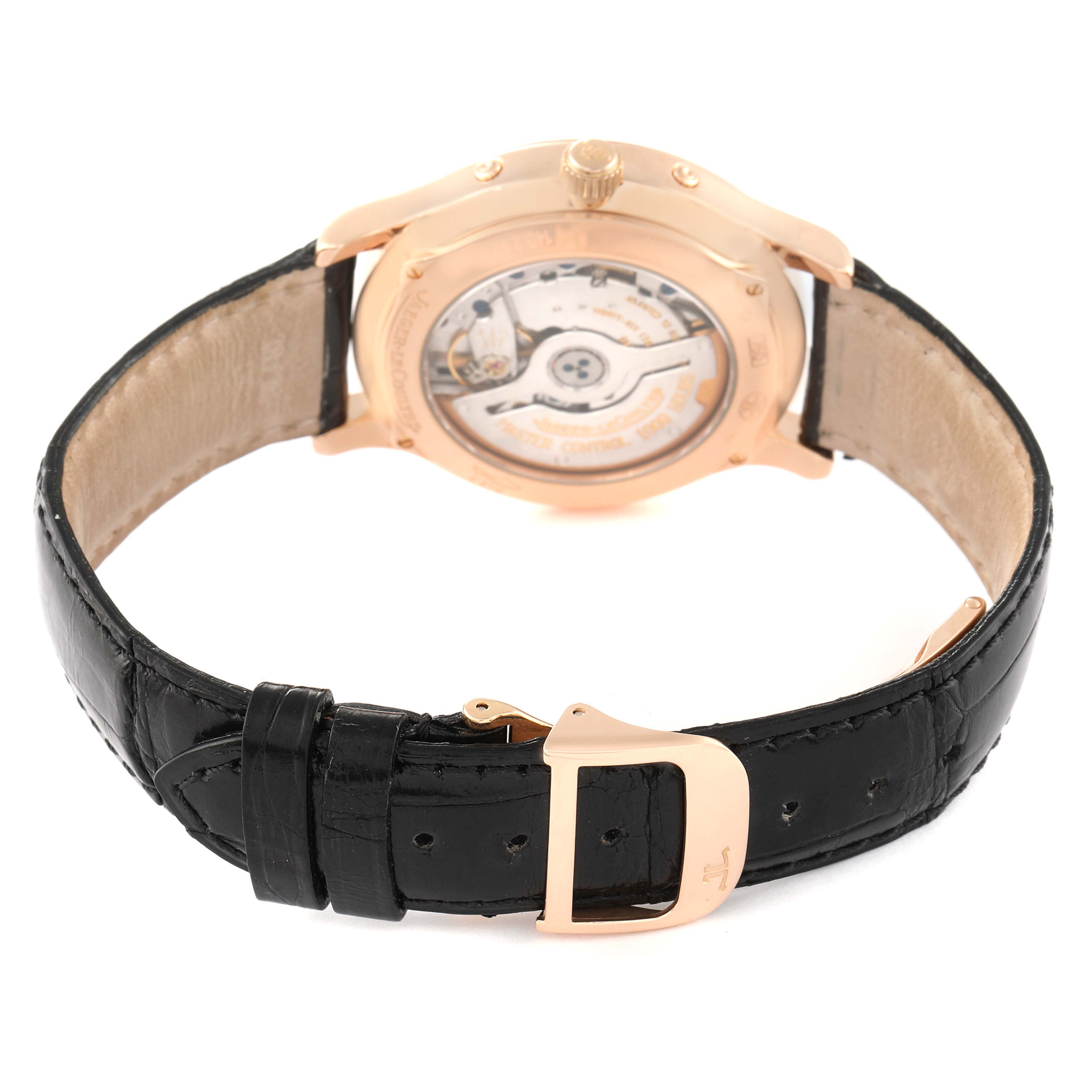 The image shows the back view of the Jaeger LeCoultre Master 140.2.98.S Men's Rose Gold Silver Dial 140.2.98.S Men's Rose Gold Silver Dial model watch, highlighting the mechanism and the black leather strap with a gold buckle.