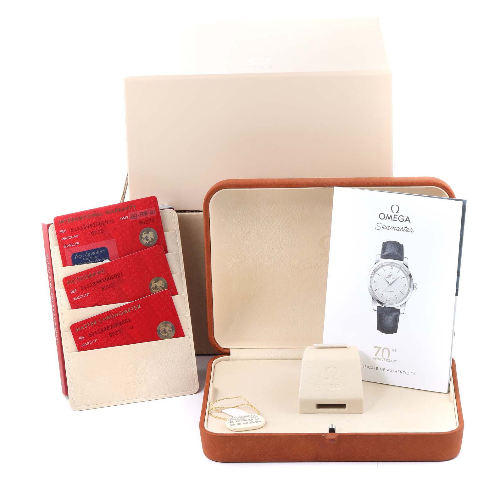 The image shows Omega Seamaster 511.13.38.20.02.001 Men's Stainless Steel Silver Dial 511.13.38.20.02.001 Men's Stainless Steel Silver Dial packaging, including a box, warranty cards, a booklet, and a watch stand.