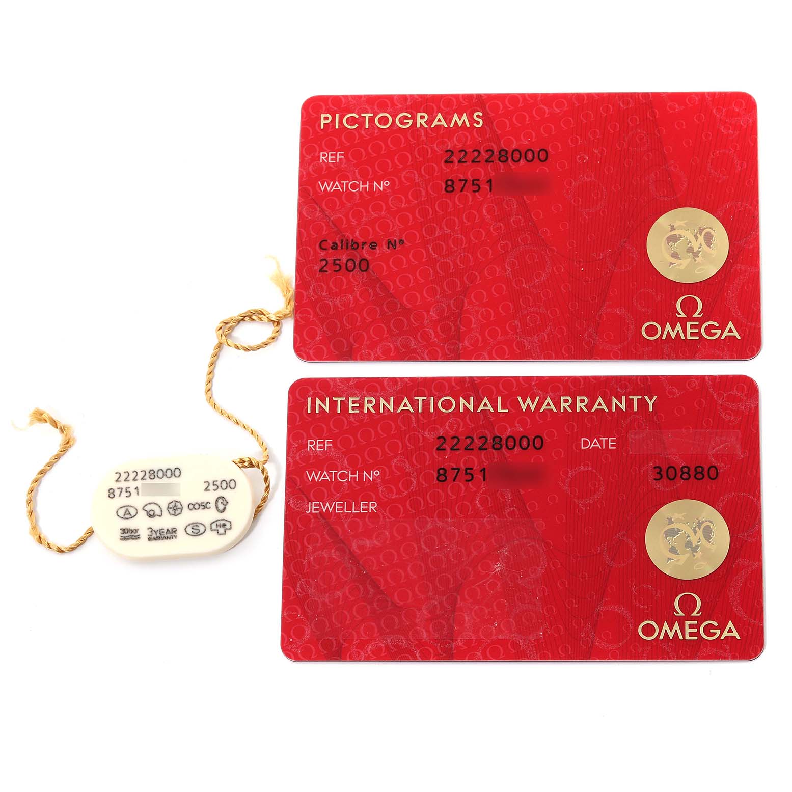 This image shows the warranty cards and a tag for an Omega Seamaster 2222.80.00 Men
s Stainless Steel Blue Dial 2222.80.00 Men
s Stainless Steel Blue Dial watch, with the cards displaying reference and serial numbers.