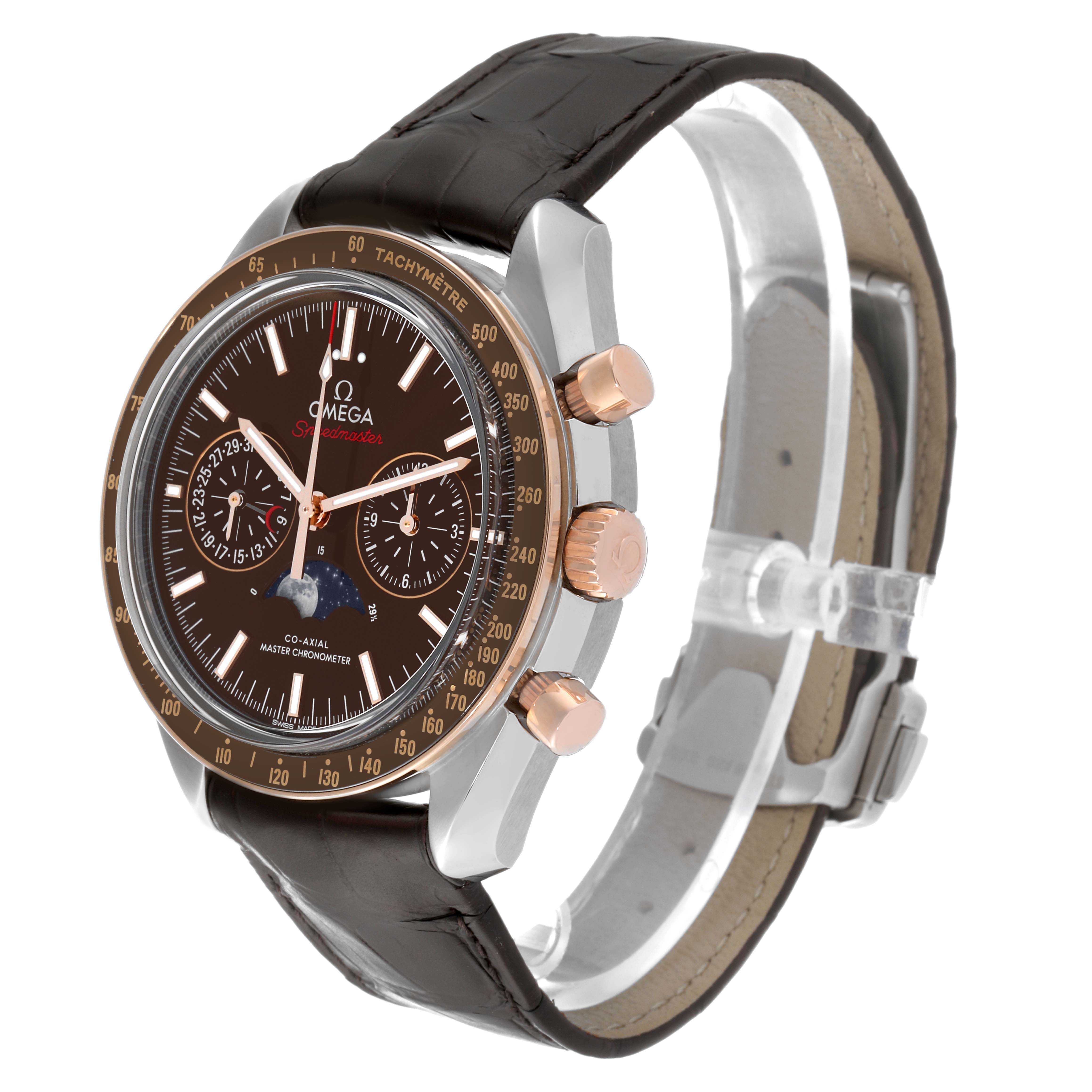 The image shows the Omega Speedmaster 304.23.44.52.13.001 Men's Steel and Gold (two tone) Brown Dial 304.23.44.52.13.001 Men's Steel and Gold (two tone) Brown Dial watch from a right-side angle, highlighting the dial, bezel, and leather strap.