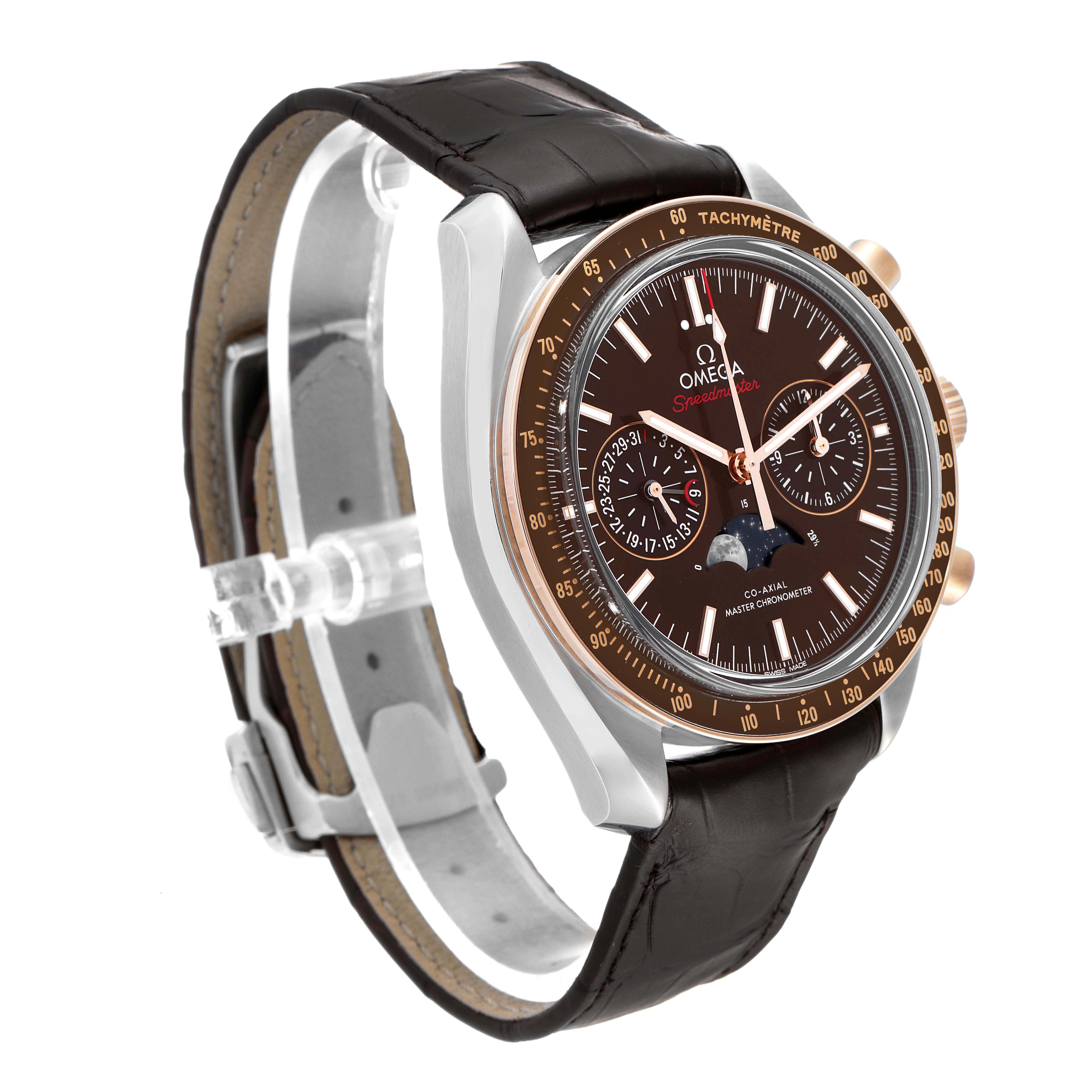 The Omega Speedmaster 304.23.44.52.13.001 Men's Steel and Gold (two tone) Brown Dial 304.23.44.52.13.001 Men's Steel and Gold (two tone) Brown Dial watch is angled to show the face, bezel, crown, and part of the strap.