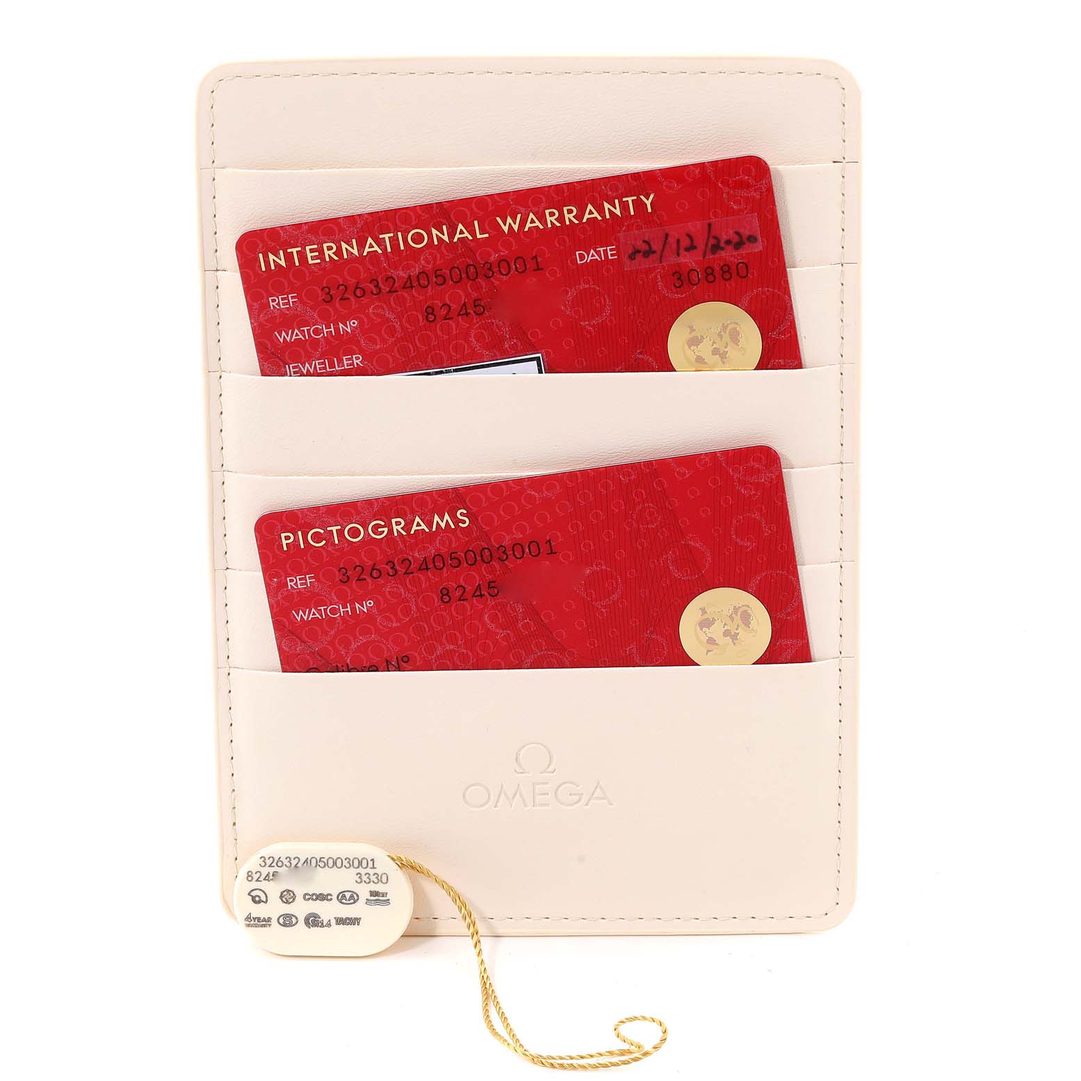 This image shows the warranty and pictograms cards for an Omega Speedmaster 326.32.40.50.03.001 Men's Stainless Steel Blue Dial 326.32.40.50.03.001 Men's Stainless Steel Blue Dial, along with a tag and card holder.