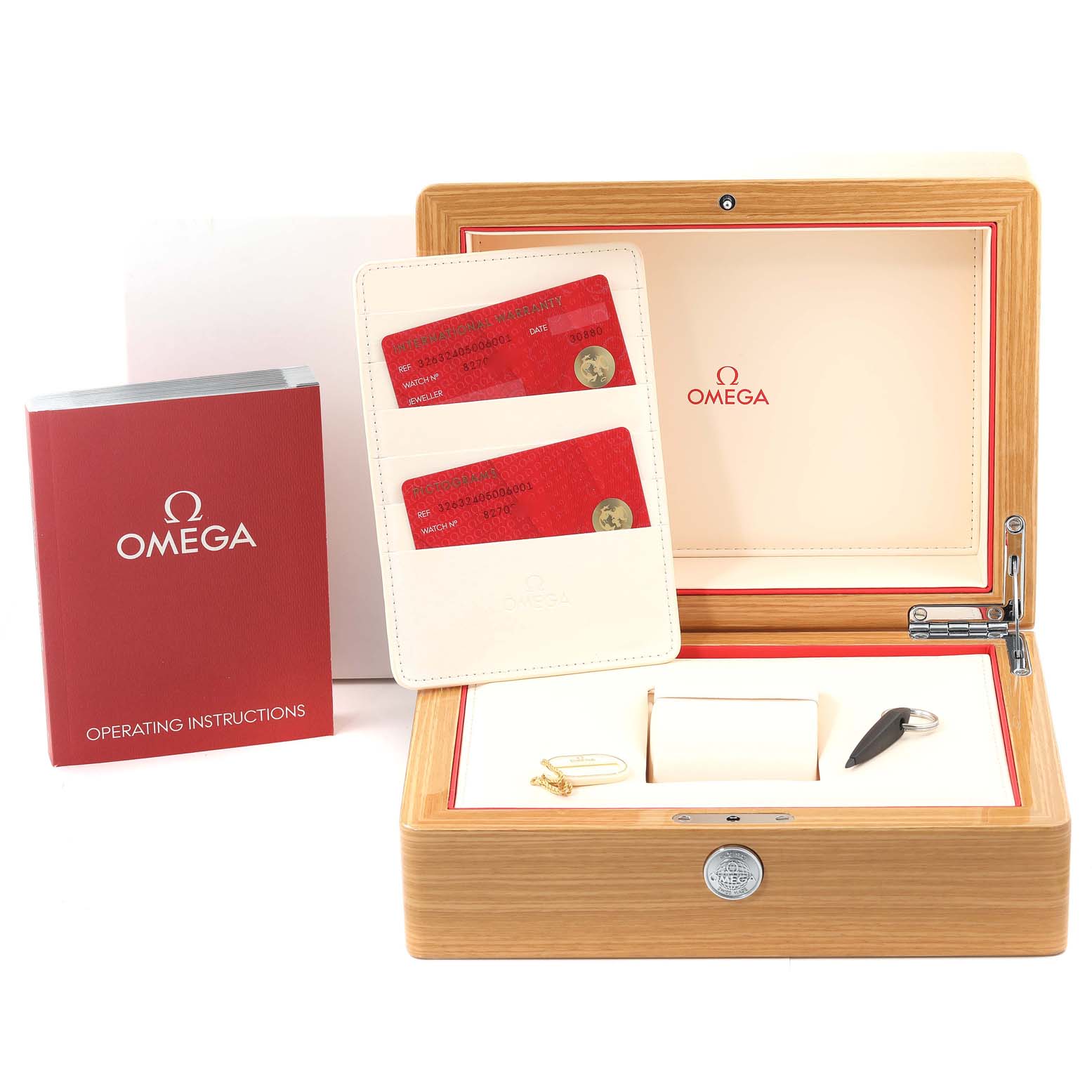 The image shows the Omega Speedmaster 326.32.40.50.06.001 Men's Stainless Steel Grey Dial 326.32.40.50.06.001 Men's Stainless Steel Grey Dial's packaging with operating instructions, warranty cards, and watch accessories.