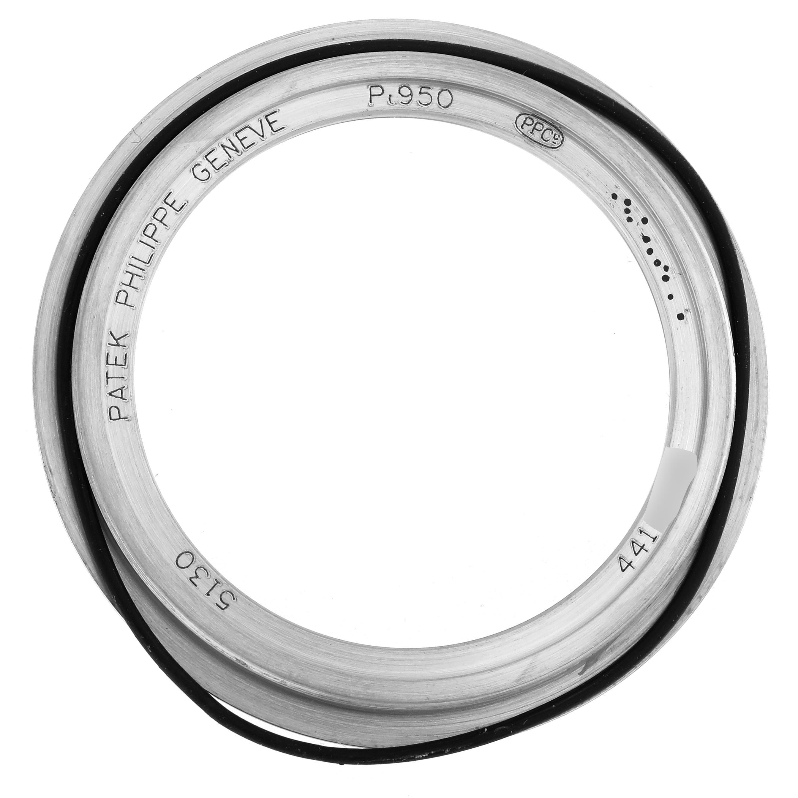 This image shows the Patek Philippe Complications 5130P Men
s Platinum Silver Dial 5130P Men
s Platinum Silver Dial watch bezel from a top-down angle.