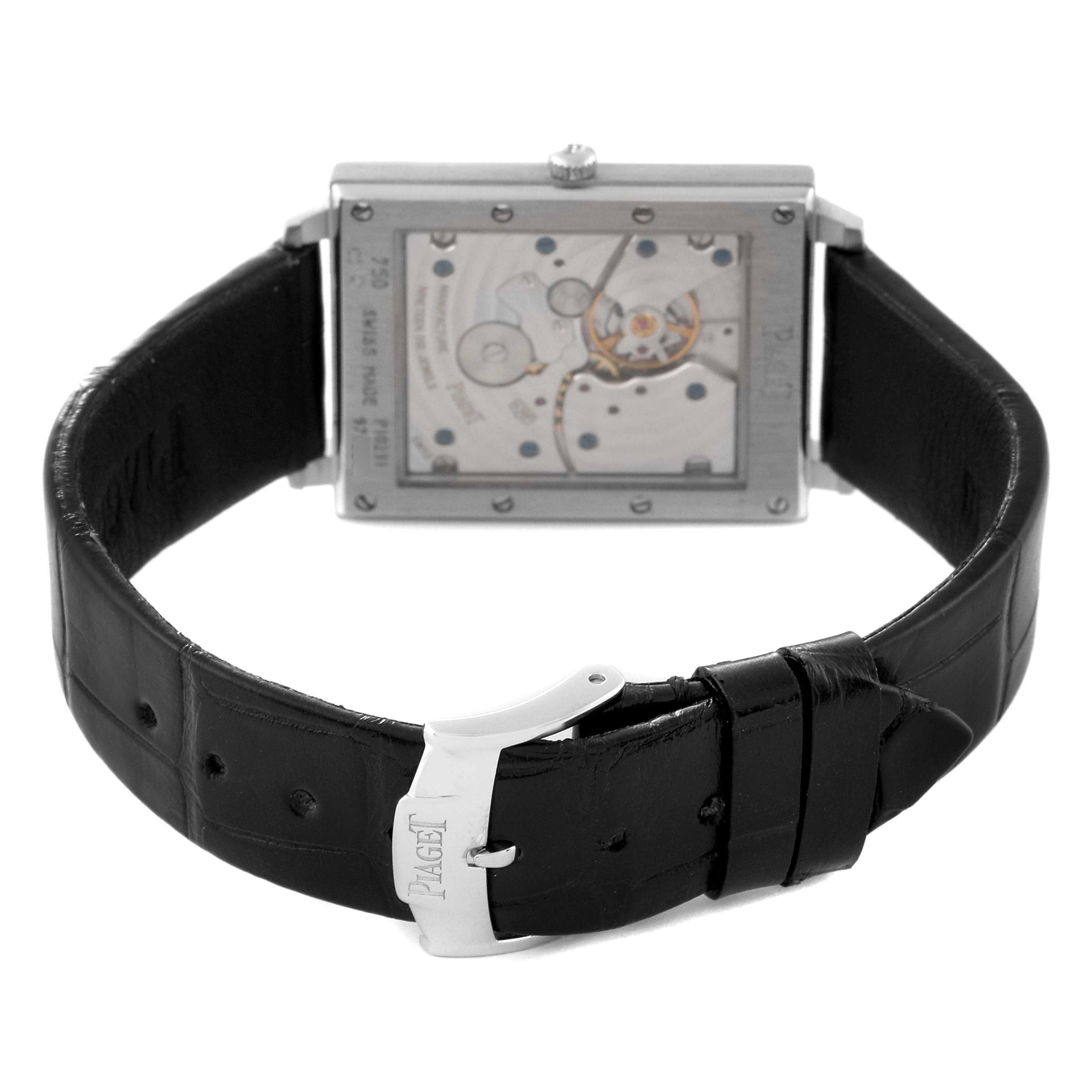 The image shows the back view of a Piaget P10291 Men's White Gold Silver Dial Black Tie White Gold Diamond Mens Watch P10291 Card, highlighting its movement and black leather strap.