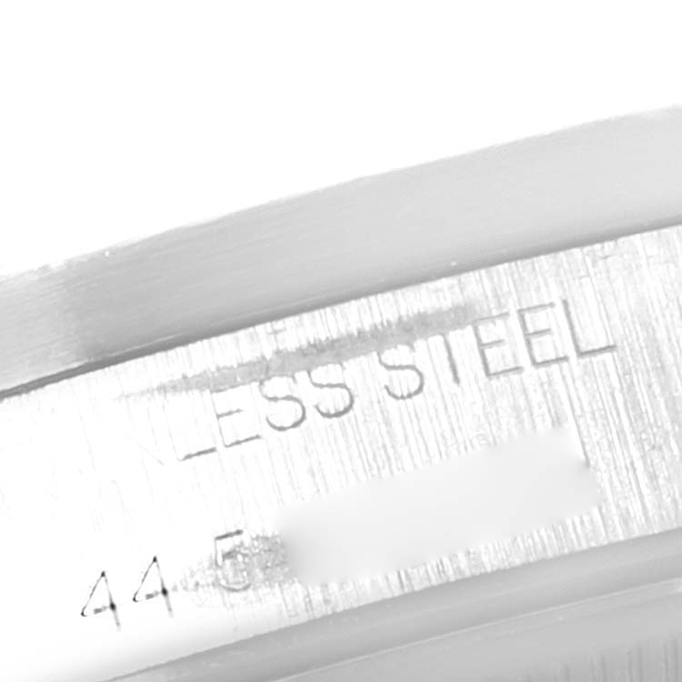 This is a close-up of the lower case side of the Rolex Air-King 14010 Men's Stainless Steel Black Dial 14010 Men's Stainless Steel Black Dial watch, displaying part of the stainless steel inscription and serial number.