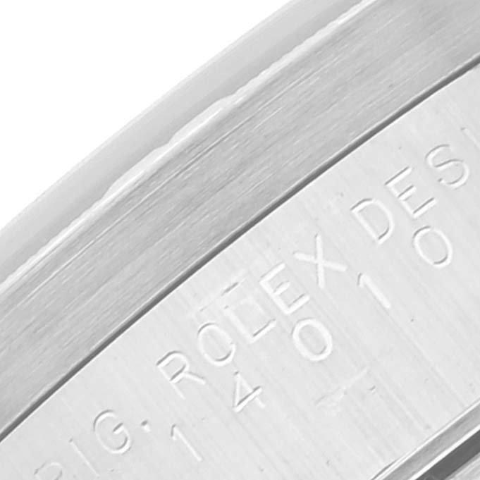 This close-up image shows the engraved edge of the bezel or case back of the Rolex Air-King 14010 Men's Stainless Steel Pink Dial 14010 Men's Stainless Steel Pink Dial watch.