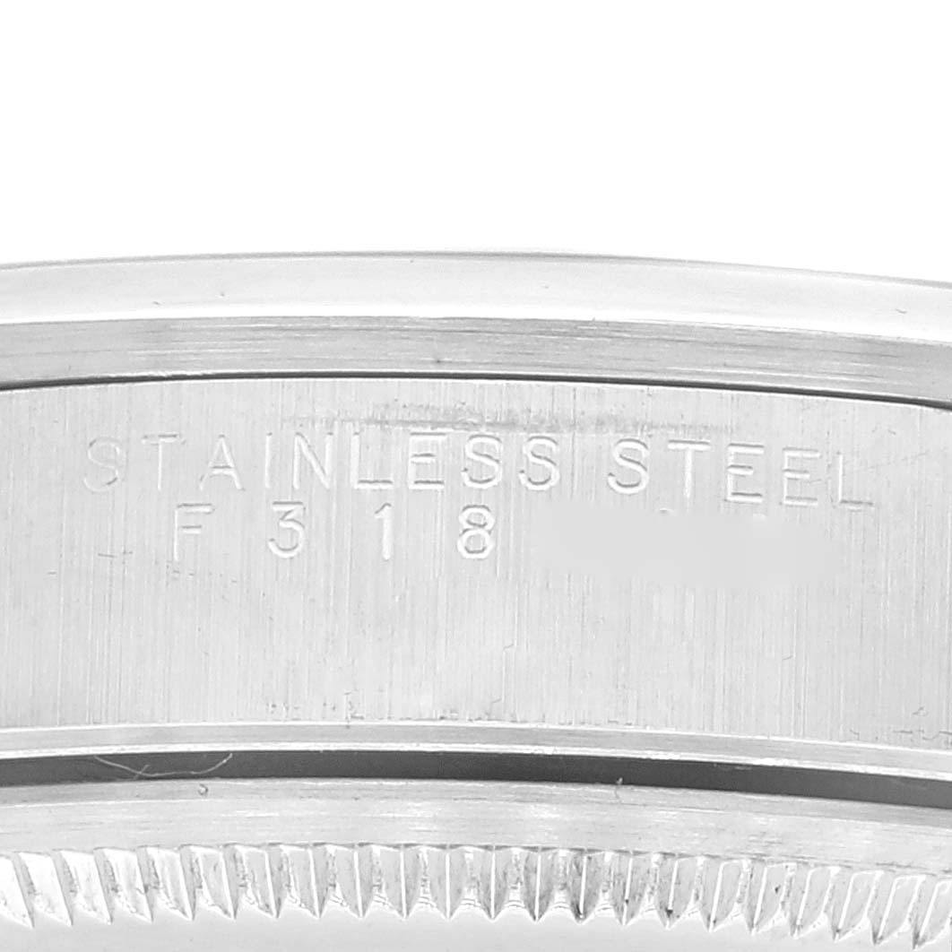 This image shows a close-up of the stainless steel bezel and case back of a Rolex Air-King 14000 Men's Stainless Steel Silver Dial 14000 Men's Stainless Steel Silver Dial watch.