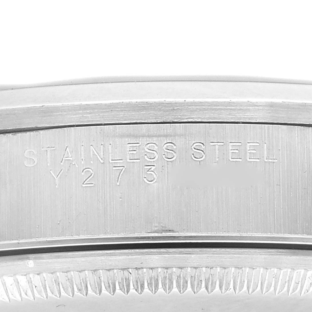 This image shows the side of a Rolex Air-King 14000 Men's Stainless Steel Black Dial 14000 Men's Stainless Steel Black Dial watch, highlighting the stainless steel engraving and part of the bezel.