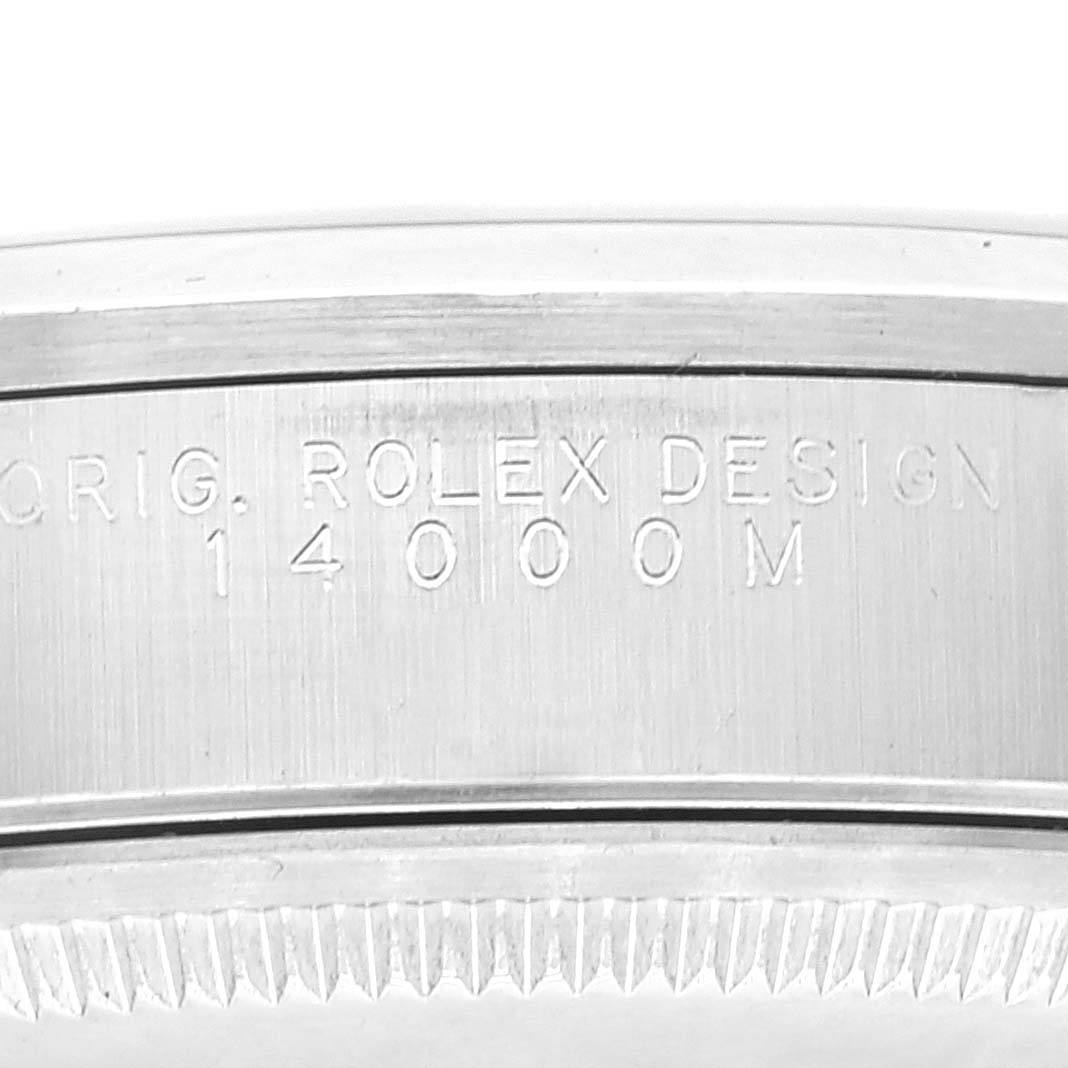 This close-up image shows the side of the case for the Rolex Air-King 14000 Men's Stainless Steel Blue Dial 14000 Men's Stainless Steel Blue Dial model with the engraving "ORIG. ROLEX DESIGN 14000M."