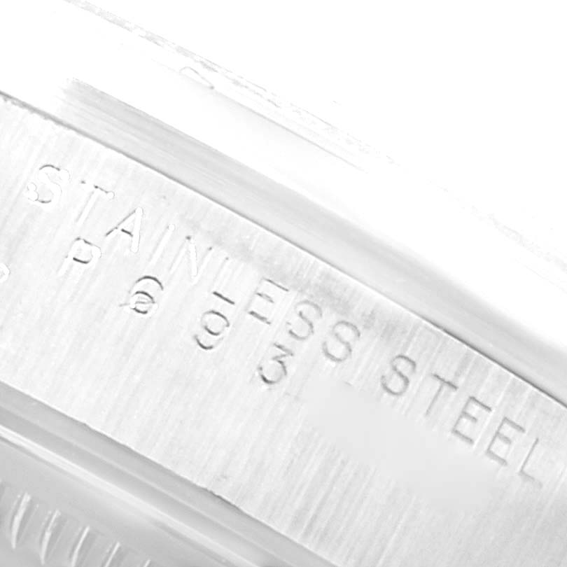 This image shows a close-up of the stainless steel casing with engravings on the Air-King watch by Rolex.
