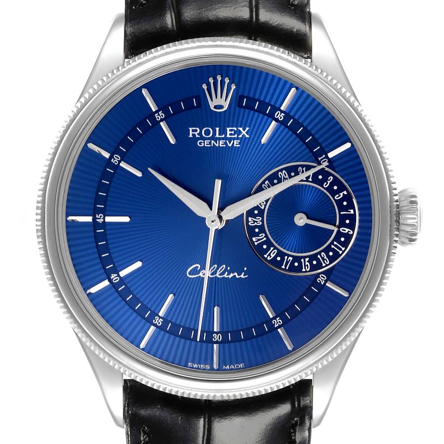 The Rolex Cellini watch is shown from the front, highlighting its blue dial, hour markers, hands, date subdial, and crown.