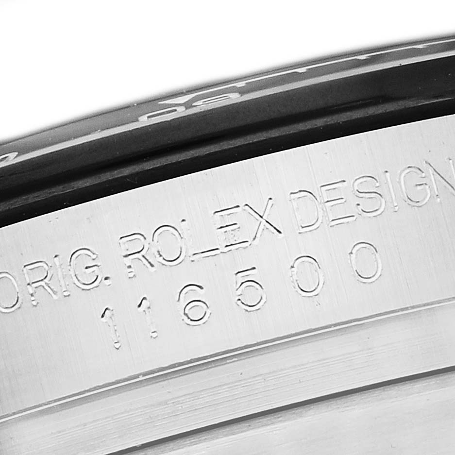This image shows a close-up of the case of a Rolex Daytona 116500 Men
s Stainless Steel Black Dial 116500 Men
s Stainless Steel Black Dial watch, focusing on the engravings.