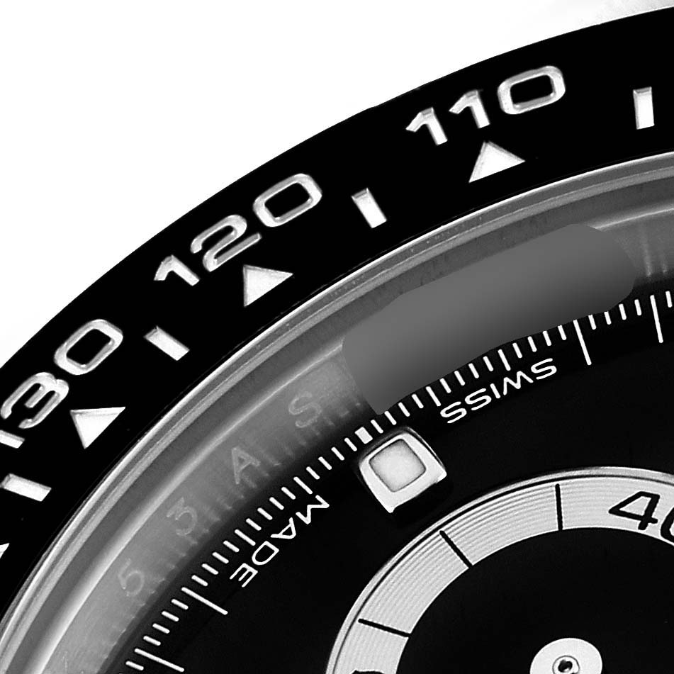 This close-up angle shows the bezel and part of the dial of the Rolex Daytona 116500 Men
s Stainless Steel Black Dial 116500 Men
s Stainless Steel Black Dial watch, highlighting the tachymeter scale.