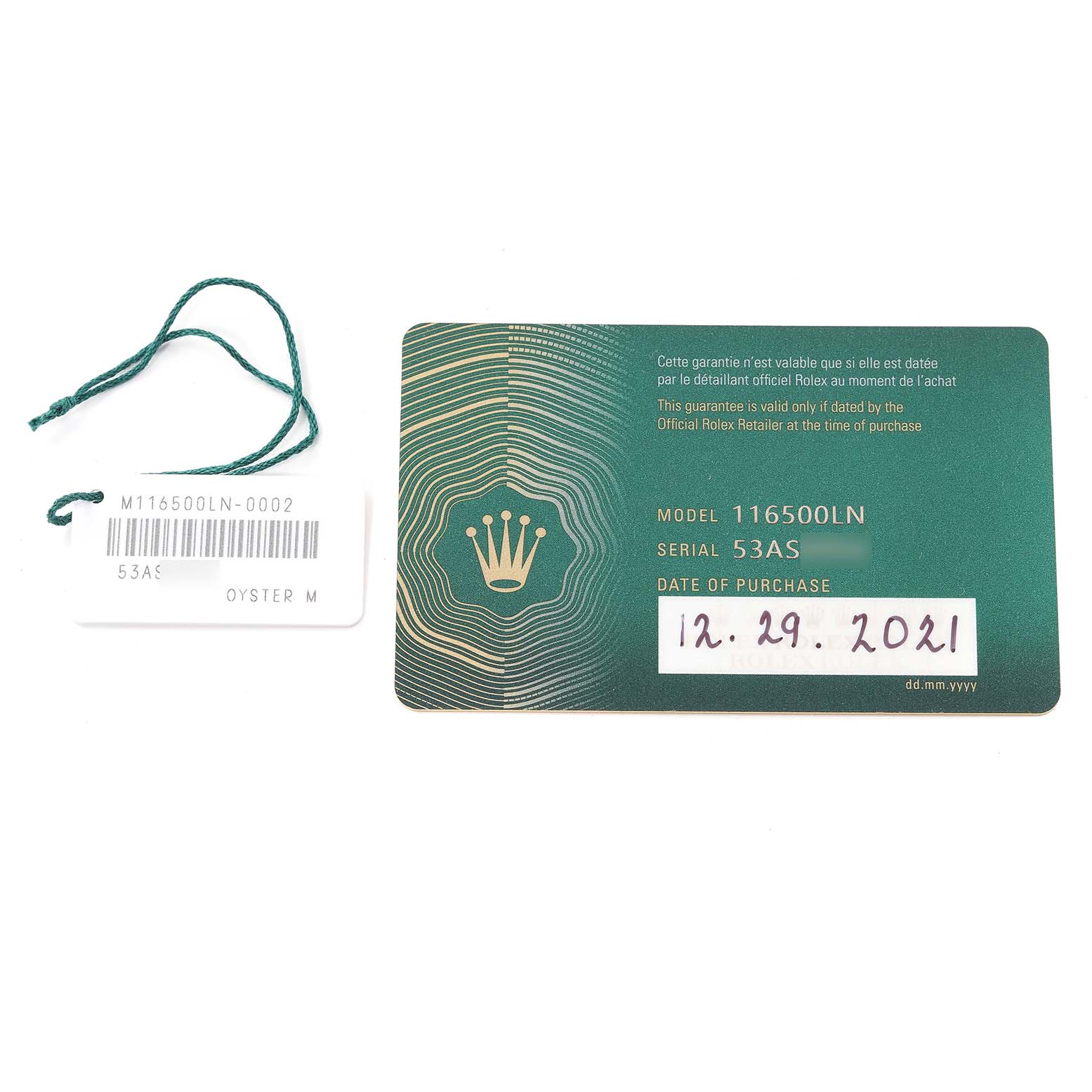 The image shows a green Rolex guarantee card and a white tag for the Daytona model 116500LN, with the purchase date of 12.29.2021.
