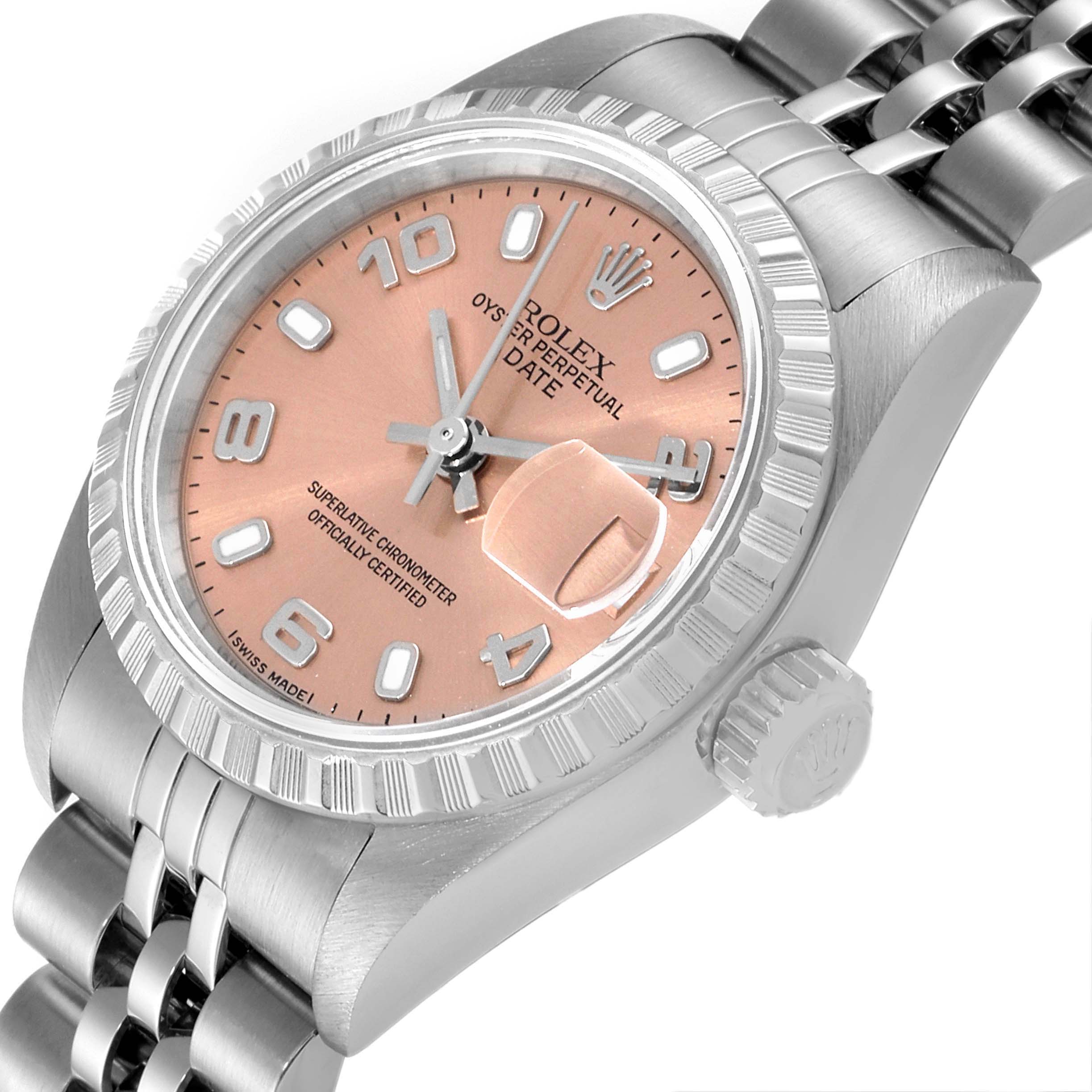 This is a close-up angle of a Rolex Date 79240 Women's Stainless Steel Pink Dial 79240 Women's Stainless Steel Pink Dial showing the dial, bezel, crown, and the Jubilee bracelet.