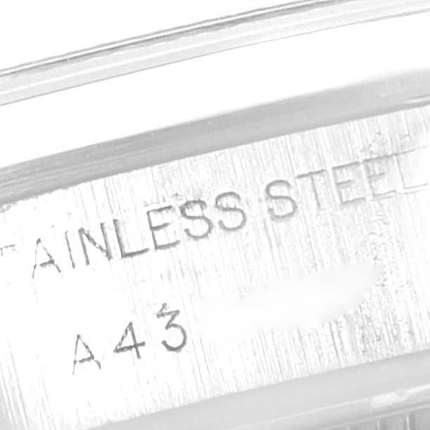 The image shows a close-up view of the stainless steel case with engraved markings on a Rolex Date 69160 Women's Stainless Steel Pink Dial 69160 Women's Stainless Steel Pink Dial model watch.