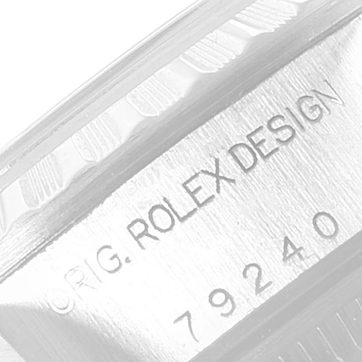This image shows a close-up of the model and serial number engraving on the case side of a Rolex Date 79240 Women
s Stainless Steel Silver Dial 79240 Women
s Stainless Steel Silver Dial watch.