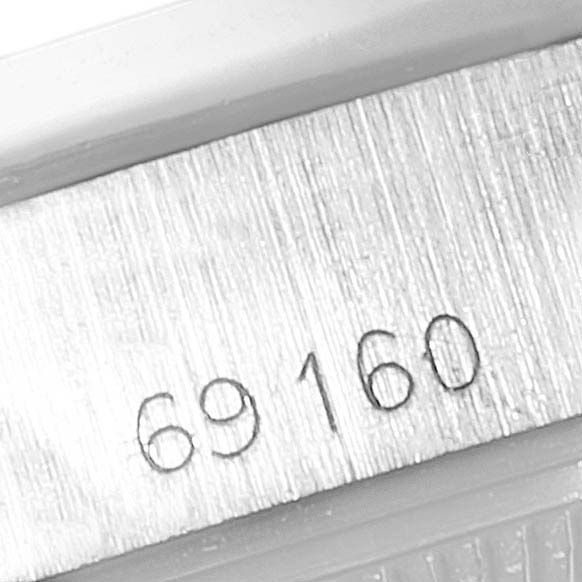 This image shows a close-up of the case number "69160" engraved on the side of a Rolex Date 69160 Women
s Stainless Steel Silver Dial 69160 Women
s Stainless Steel Silver Dial watch.