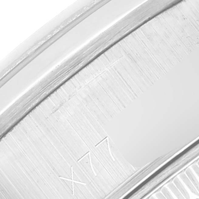 This image shows a close-up view of the side of the metal case for a Rolex Oyster Perpetual 69160 Women's Stainless Steel Silver Dial 69160 Women's Stainless Steel Silver Dial watch.