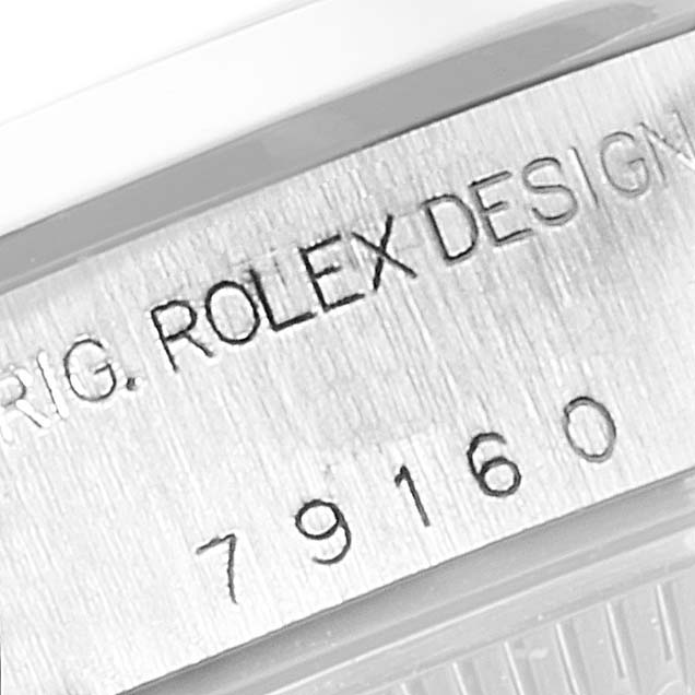 This close-up image shows the model number and “ROLEX DESIGN” engraving on the case of a Rolex Date 79160 Women
s Stainless Steel Silver Dial 79160 Women
s Stainless Steel Silver Dial watch.