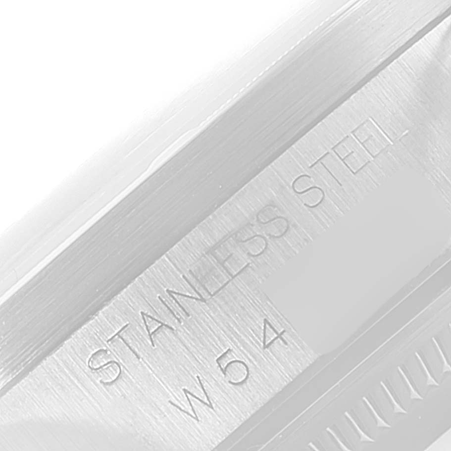 This is a close-up image of the side of a Rolex Date 15210 Men's Stainless Steel Silver Dial 15210 Men's Stainless Steel Silver Dial model watch showing the "STAINLESS STEEL" engraving.