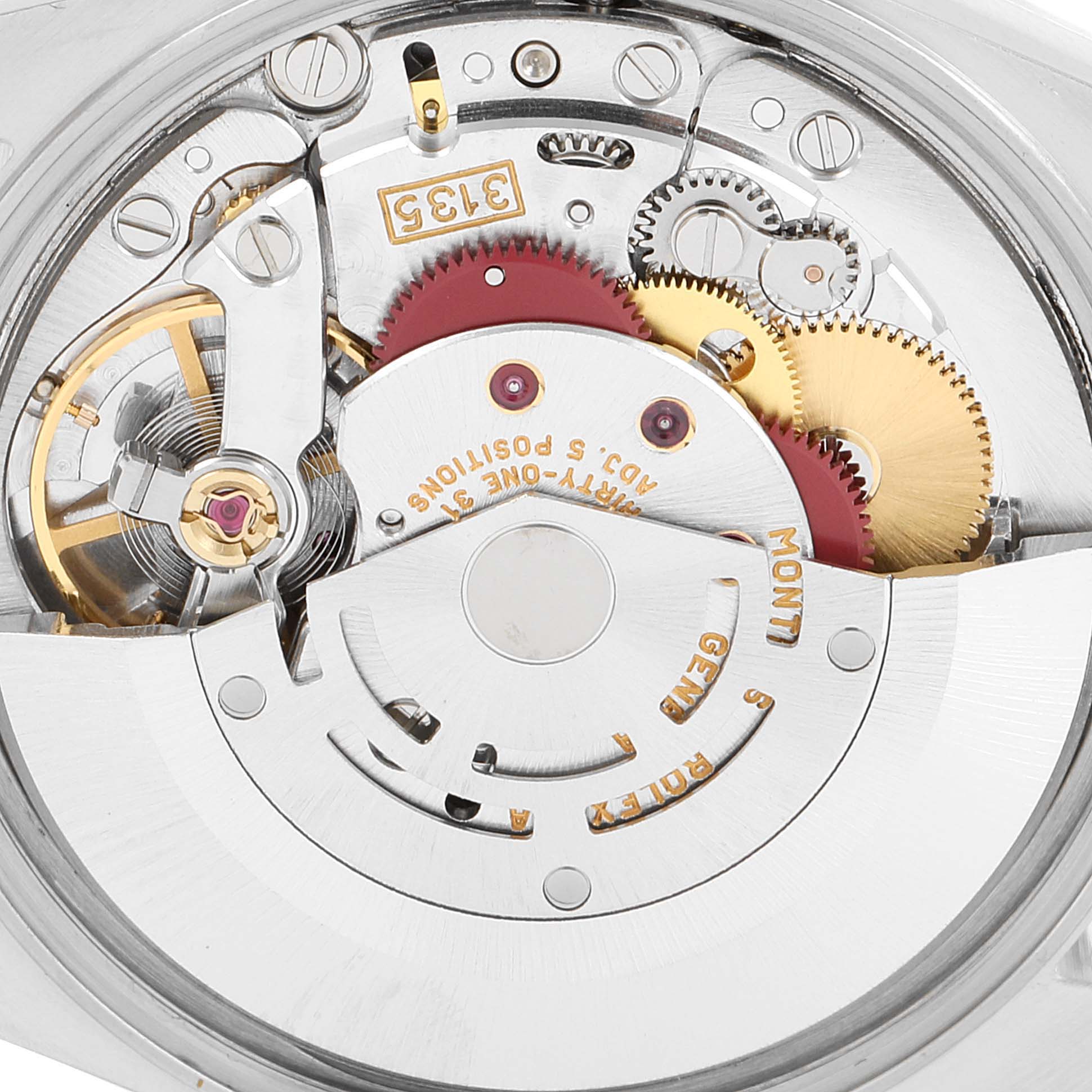 The image shows the intricate internal movement mechanism of a Rolex Date 15210 Men's Stainless Steel Silver Dial 15210 Men's Stainless Steel Silver Dial model watch, highlighting gears and inscriptions.