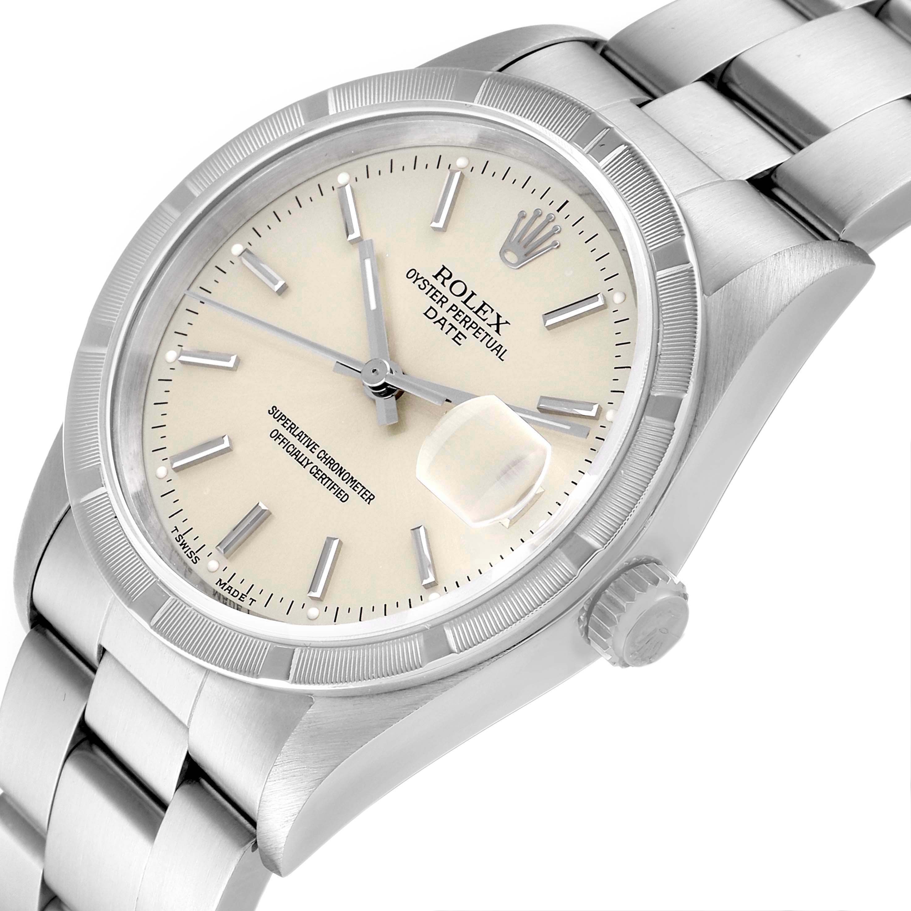 The image shows a Rolex Date 15210 Men's Stainless Steel Silver Dial 15210 Men's Stainless Steel Silver Dial model watch from an angled top-down perspective, highlighting the dial, bezel, and part of the bracelet.