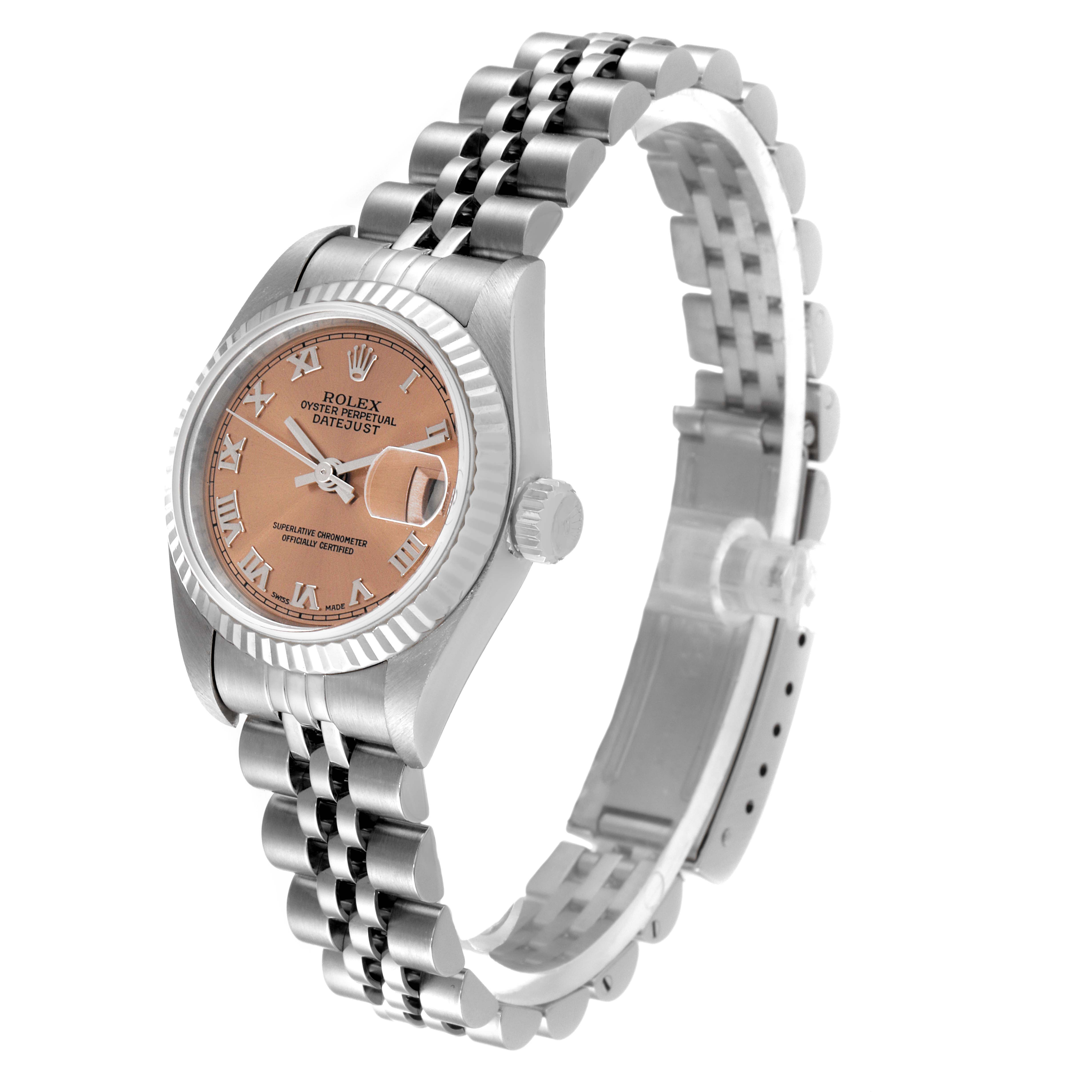 This image shows a Rolex Datejust 79174 Women's Stainless Steel Pink Dial 79174 Women's Stainless Steel Pink Dial watch from a three-quarter angle, highlighting the dial, bezel, and Jubilee bracelet.
